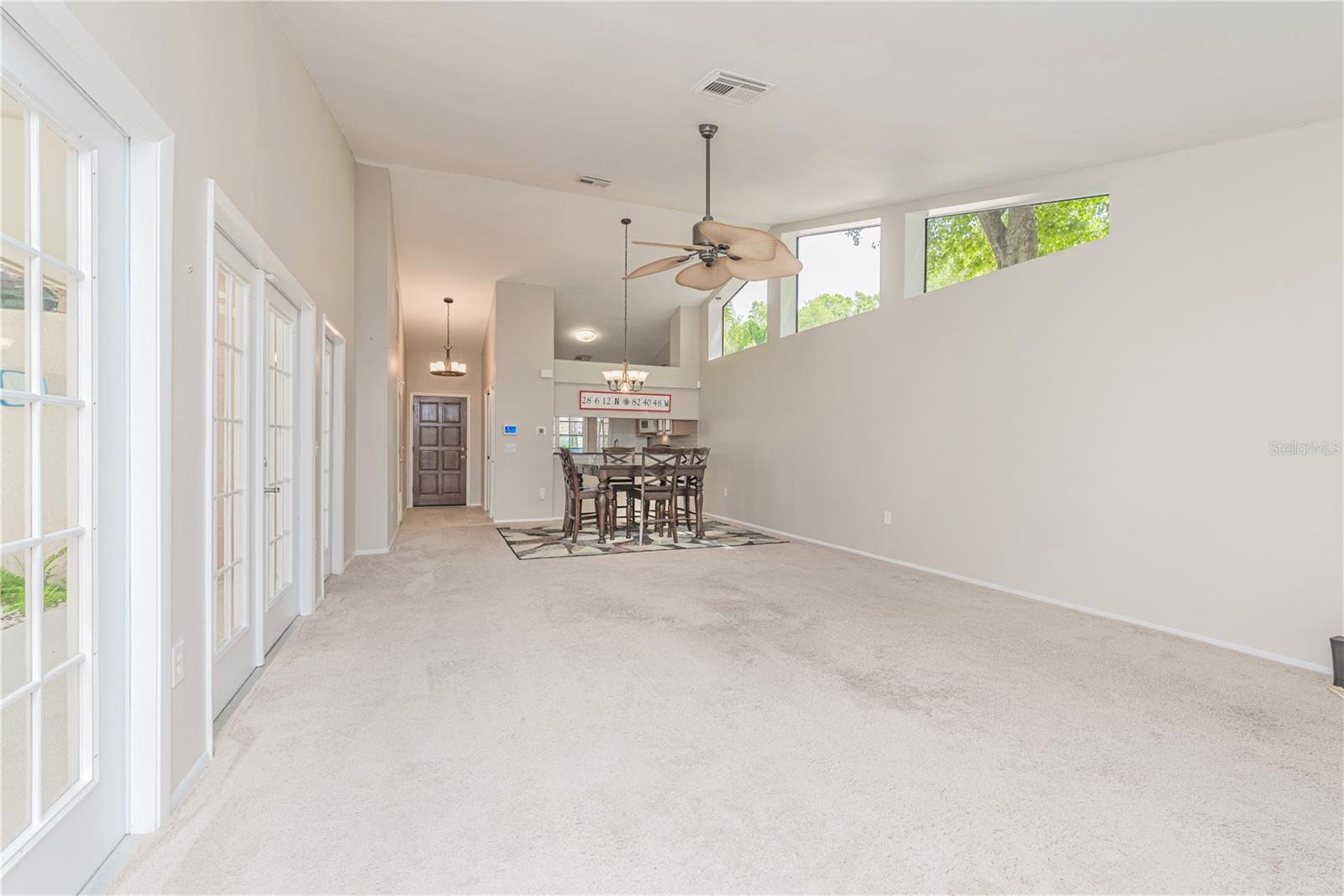 Living room with vaulted ceilings.