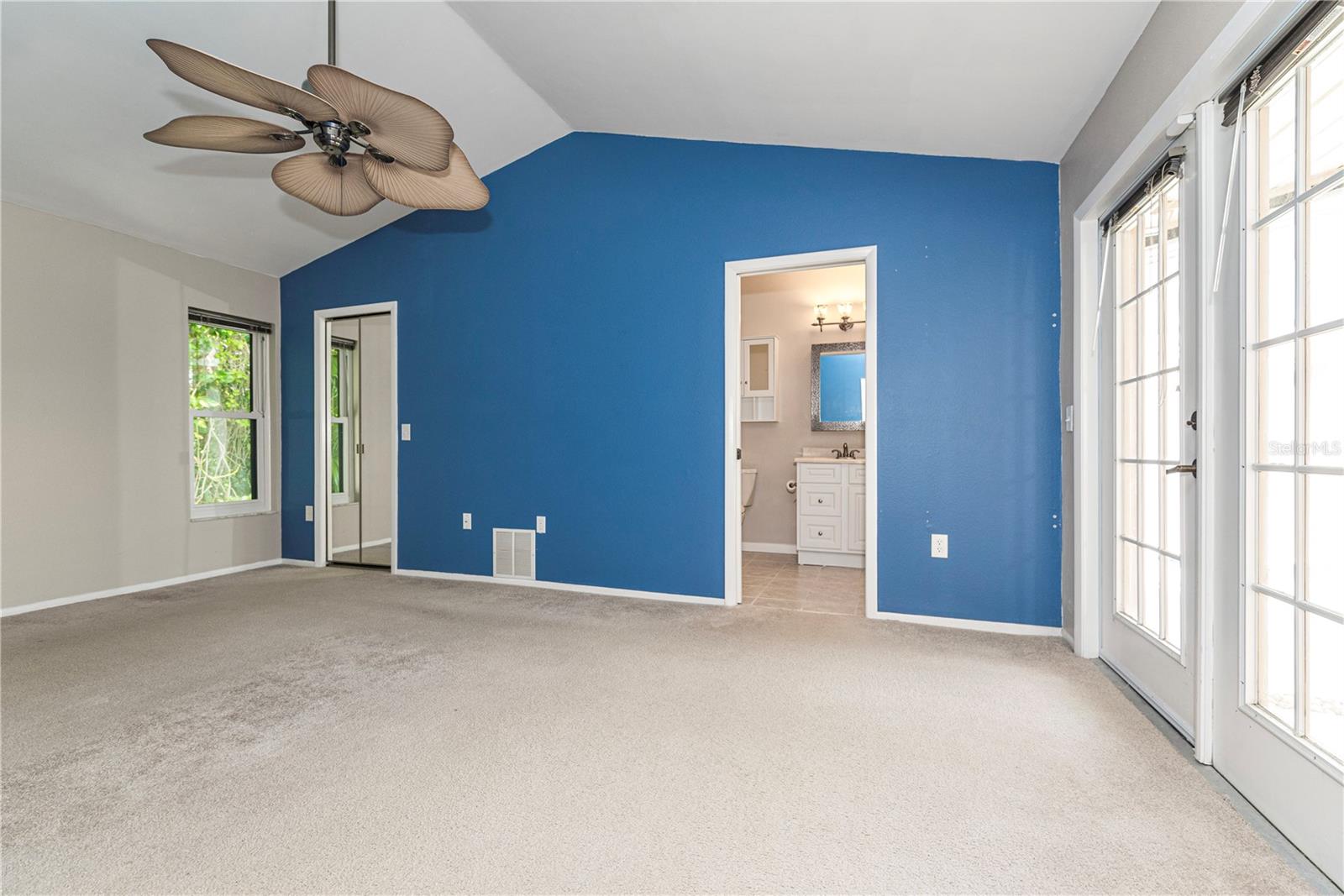 Primary bedroom with ensuite bath and walk-in closet.