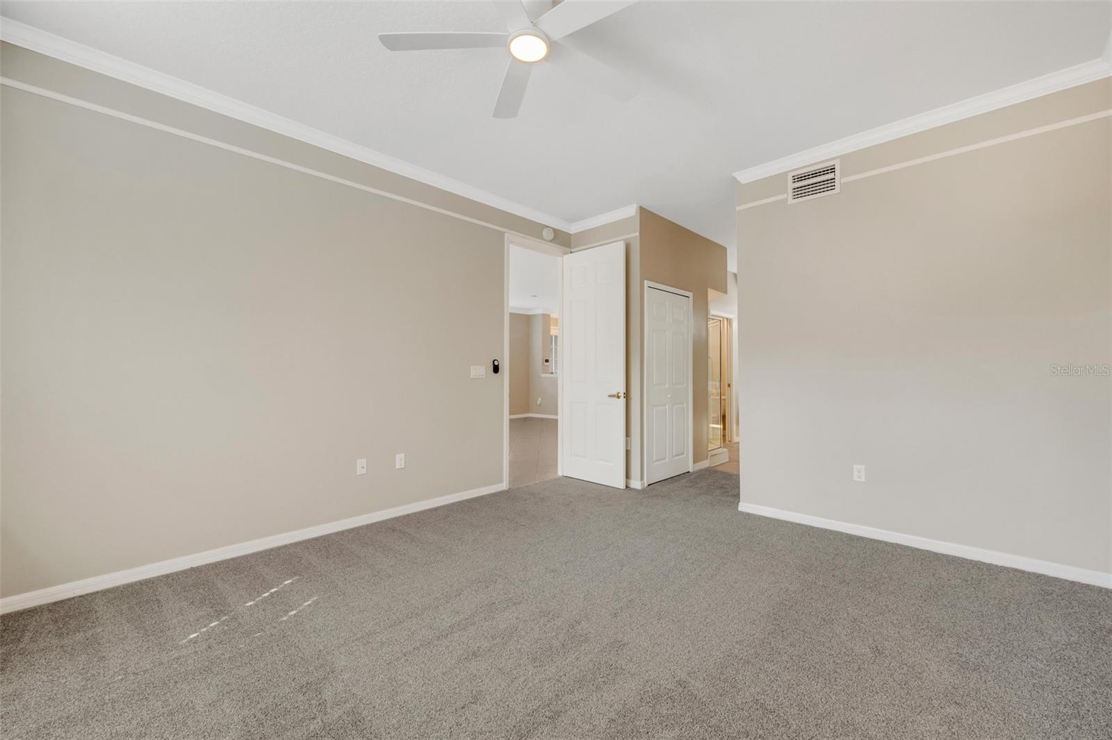 Primary bedroom, entrance to bathroom is on right