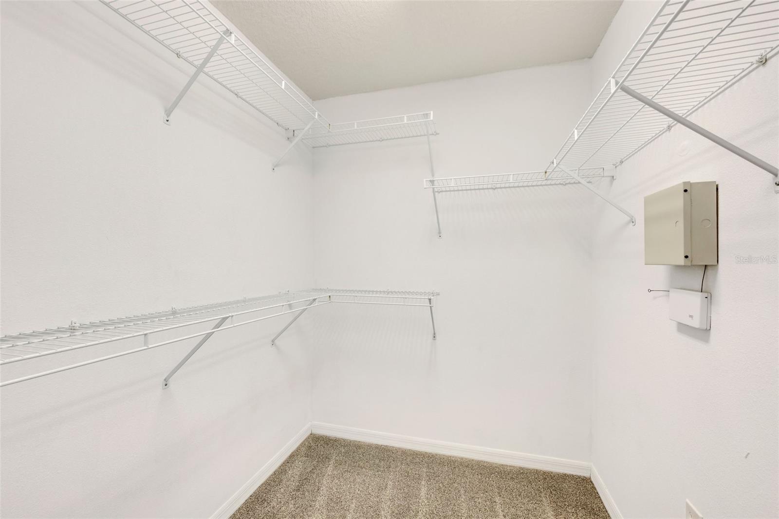 Walk-in closet in primary bathroom