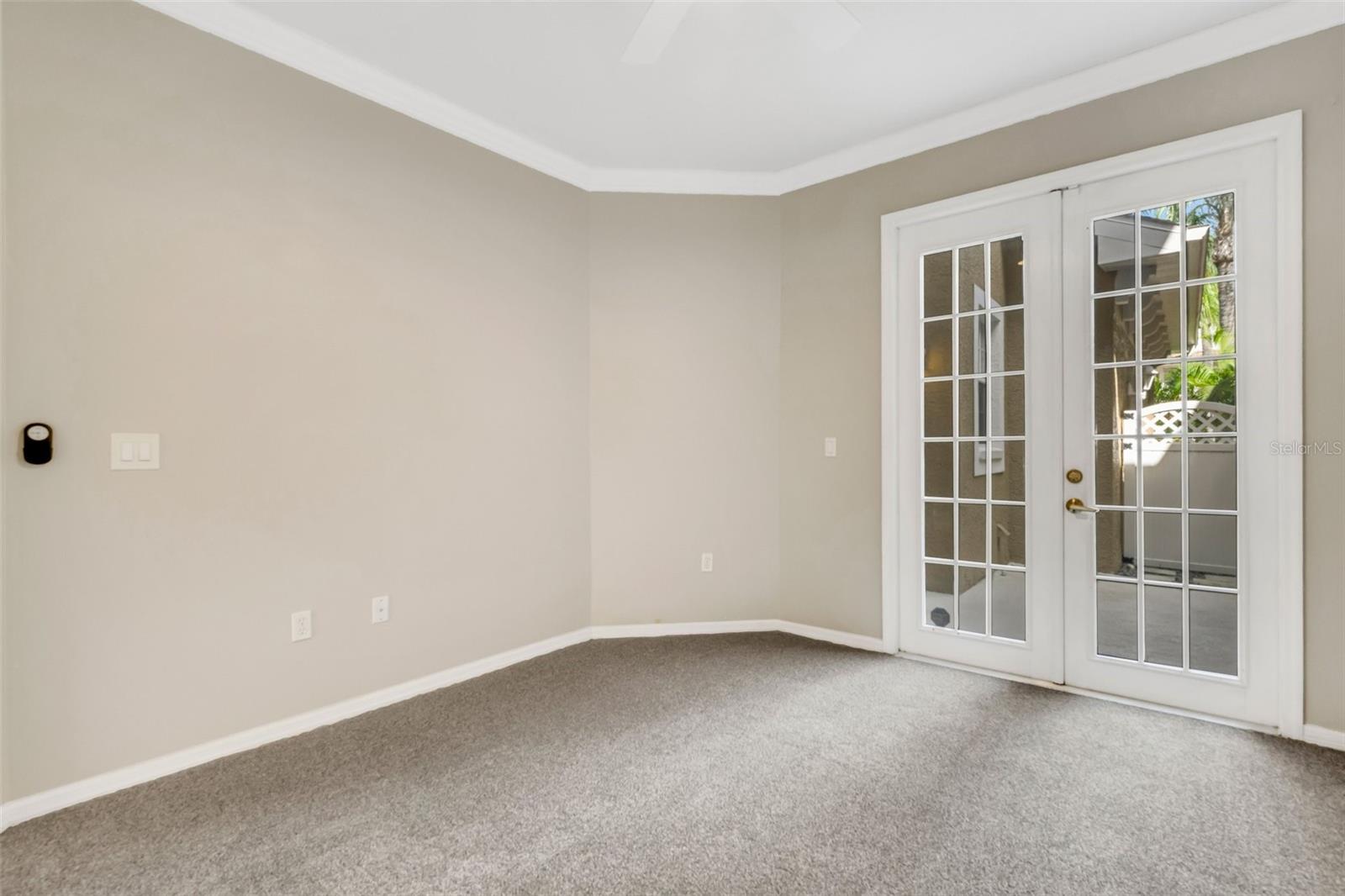 Bedroom #2 with French doors that lead to the private courtyard!