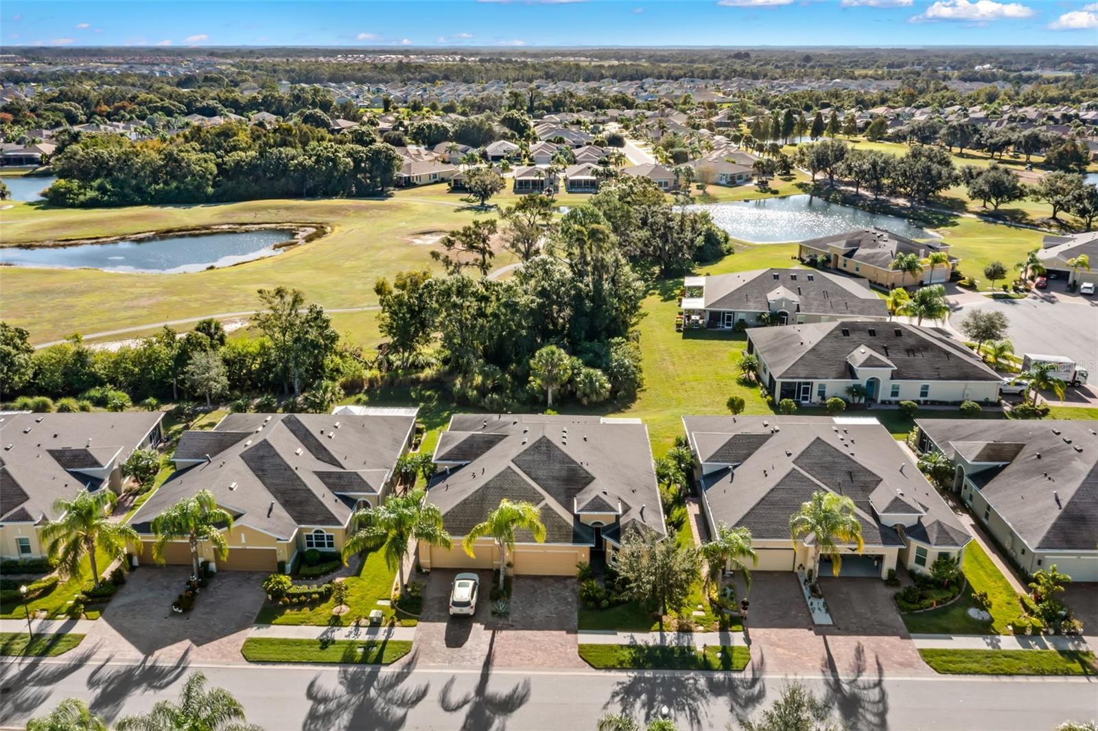 Aerial prior to roof change showcasing the lot.