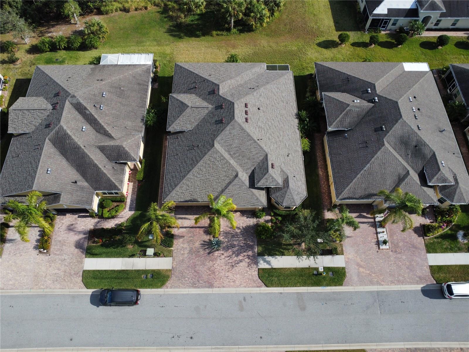 Aerial prior to roof change showcasing the lot.