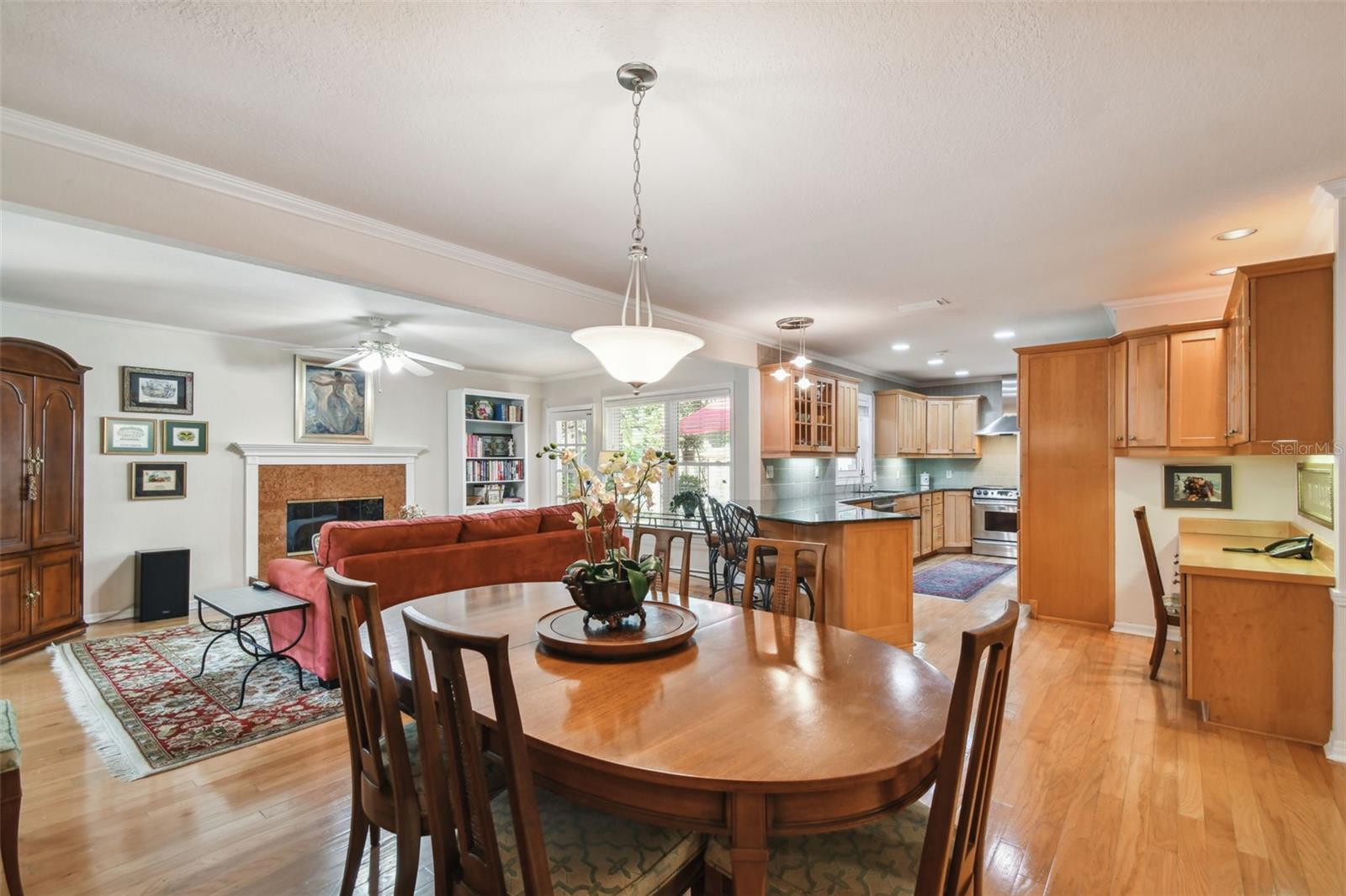 Open concept view of kitchen, dining and family room