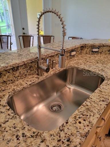 Close-up of new Countertops, Undermount Sink & Commercial-style Faucet