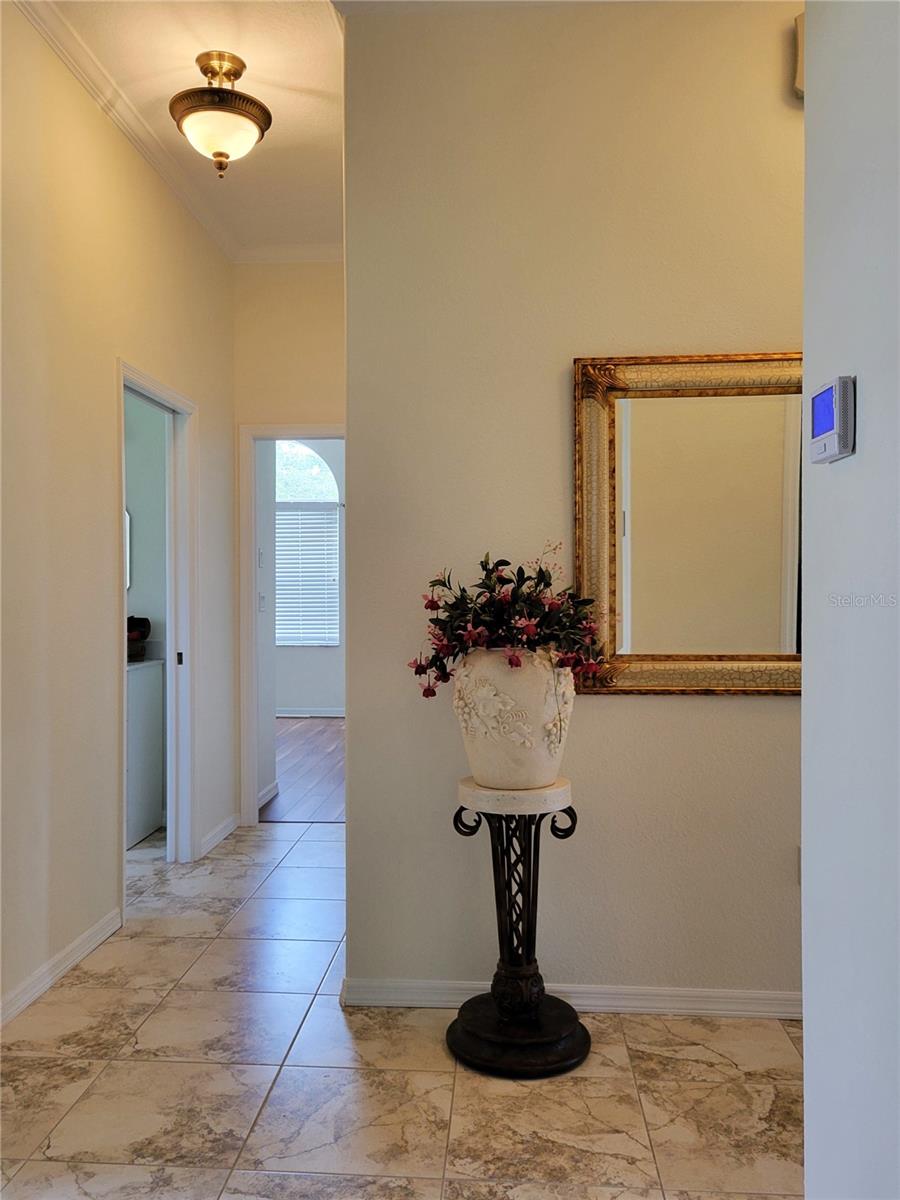 Hallway outside Laundry room, looking toward one of 2 Secondary Bedrooms