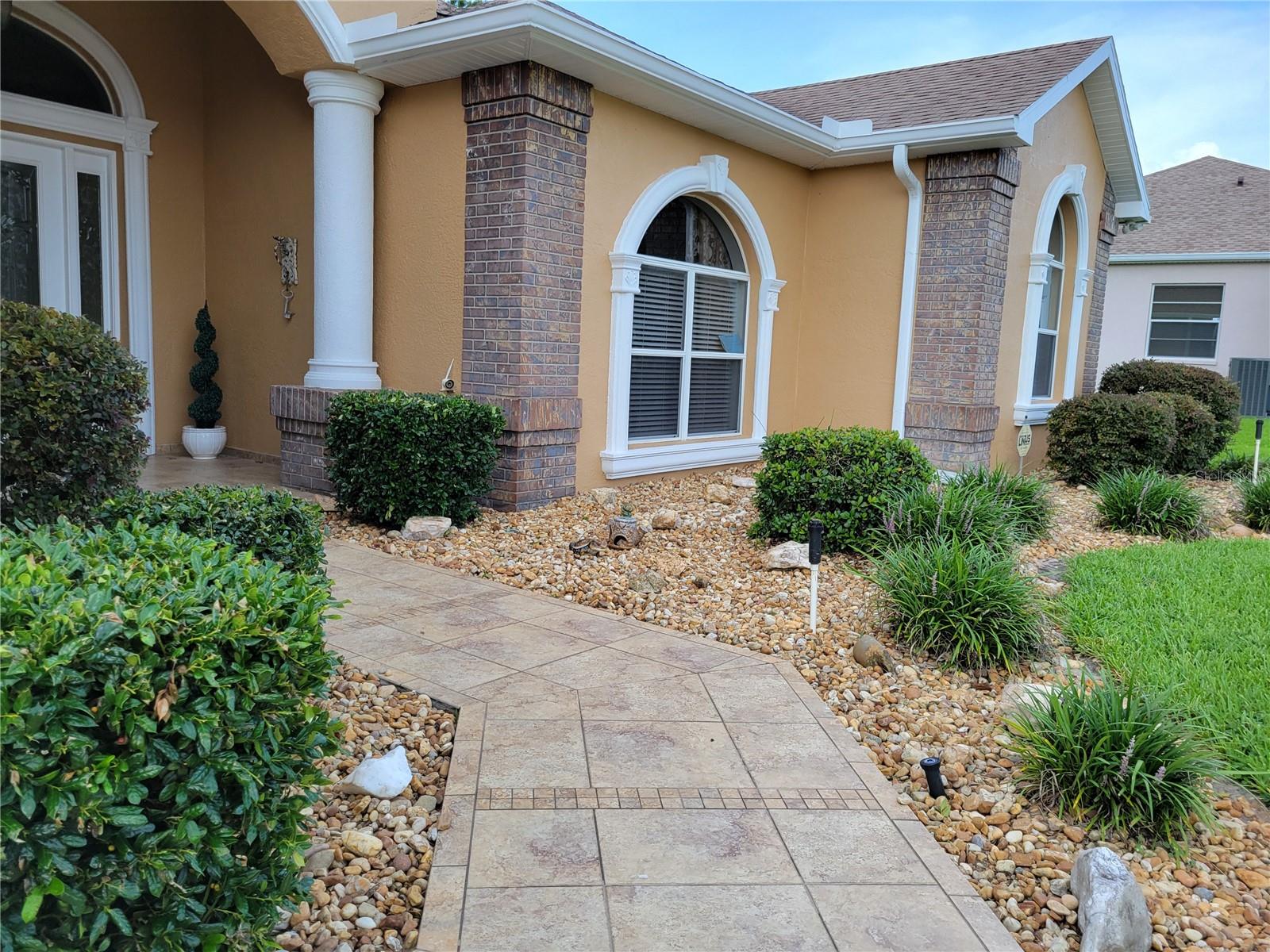 Tiled Sidewalk & Other Exterior Upgrades in Front