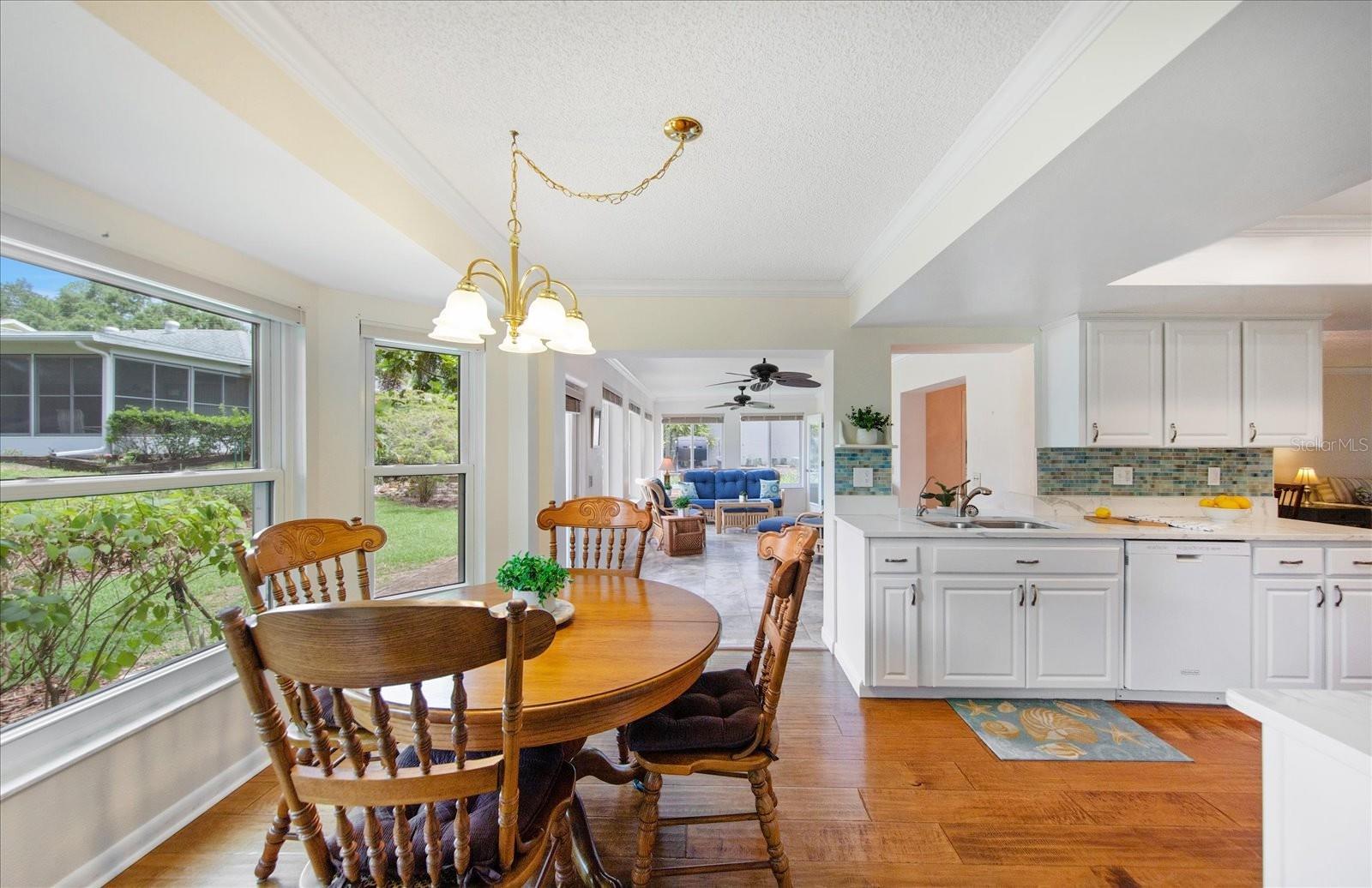 Casual dining nook with sunny bay windows~