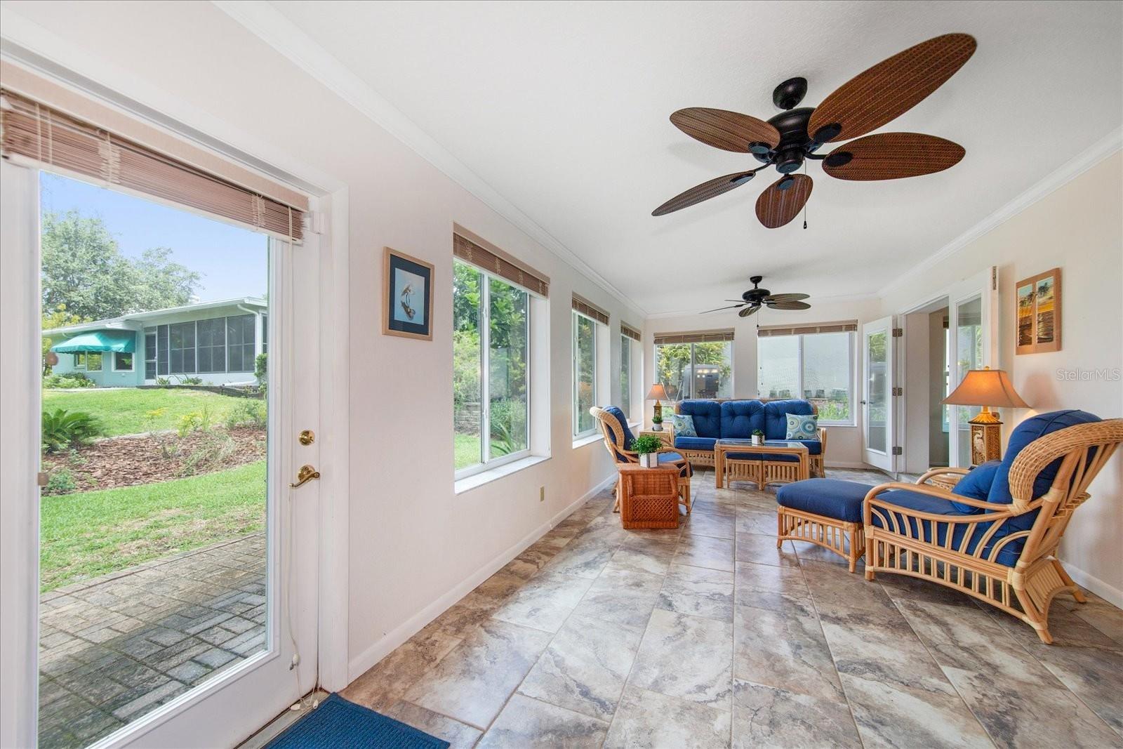 Kitchen, dining room & master suite all access the finished Florida room and back patio~