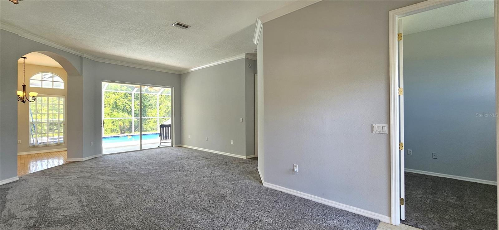 living room and view of the office/guest room