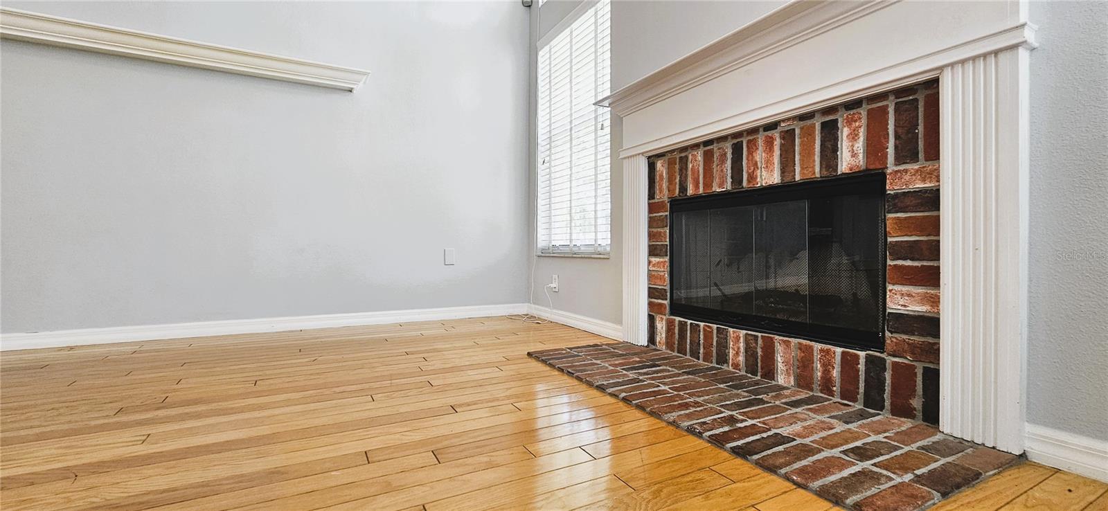 Wood burning fireplace in the family room