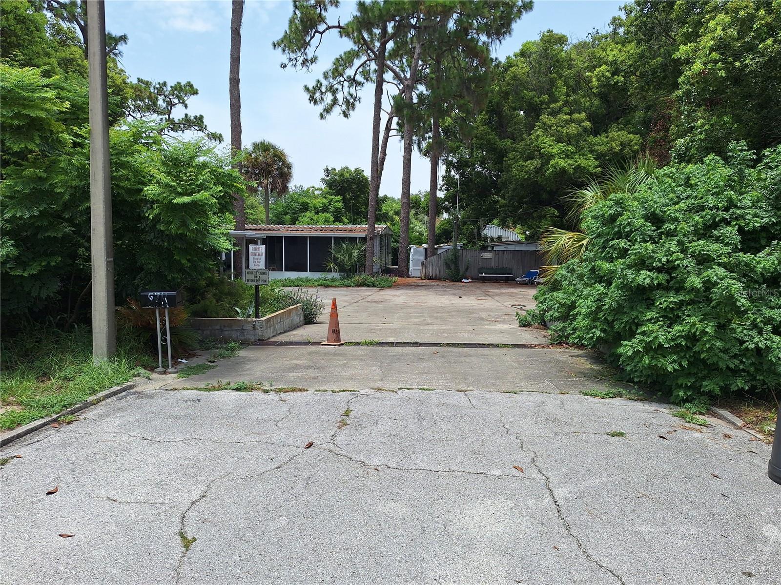 COMPOUND ENTRANCE AT END OF DURIAN TRAIL