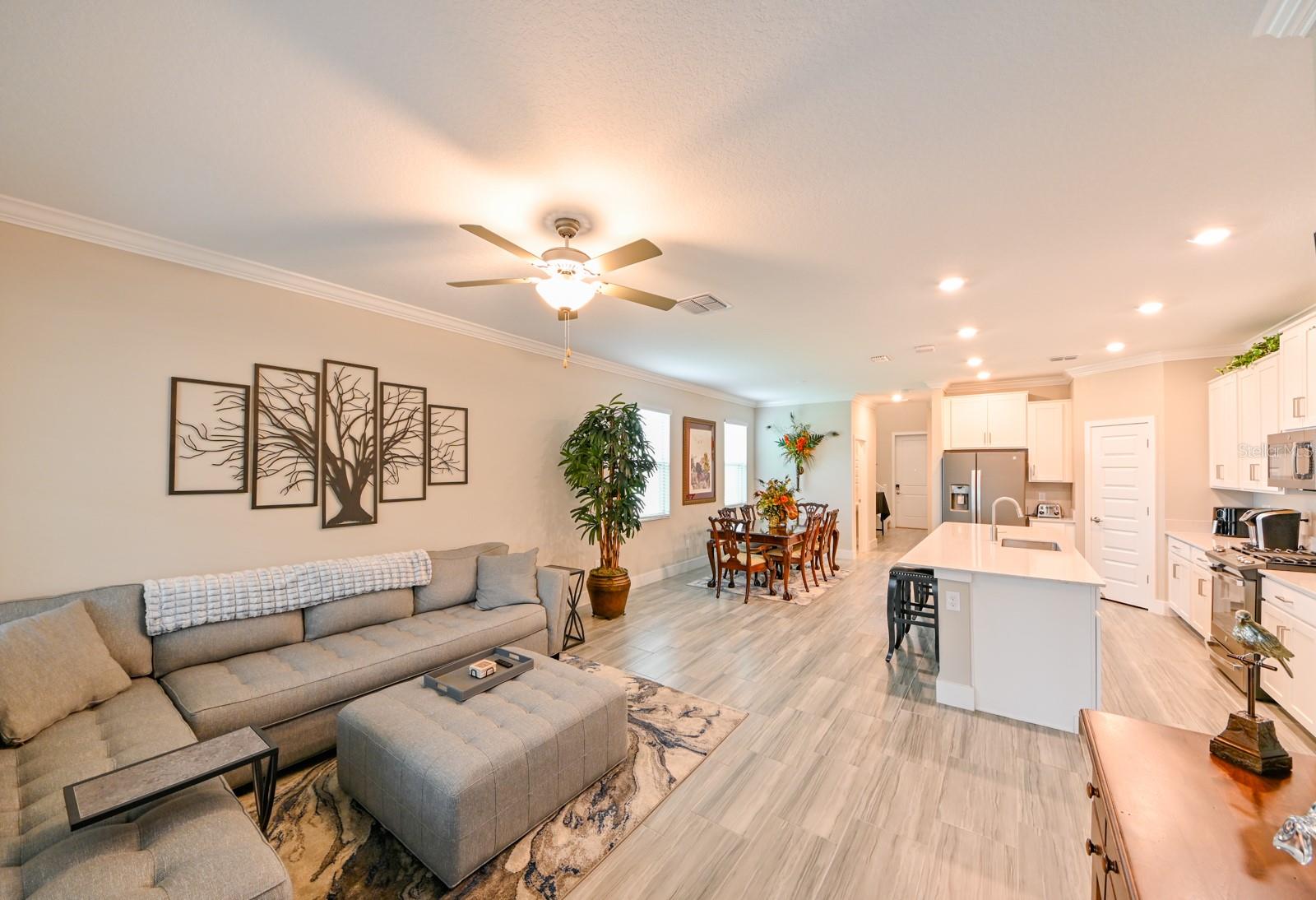 Living Room Opens to Kitchen & Dining Area