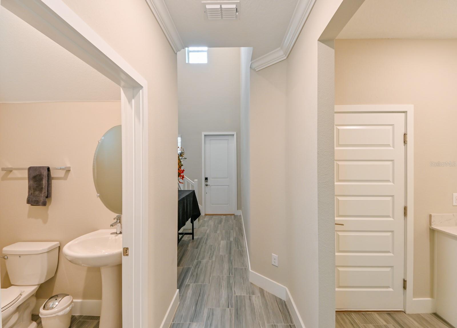 Powder Bathroom on Left and Laundry Room on Right - Front door in middle