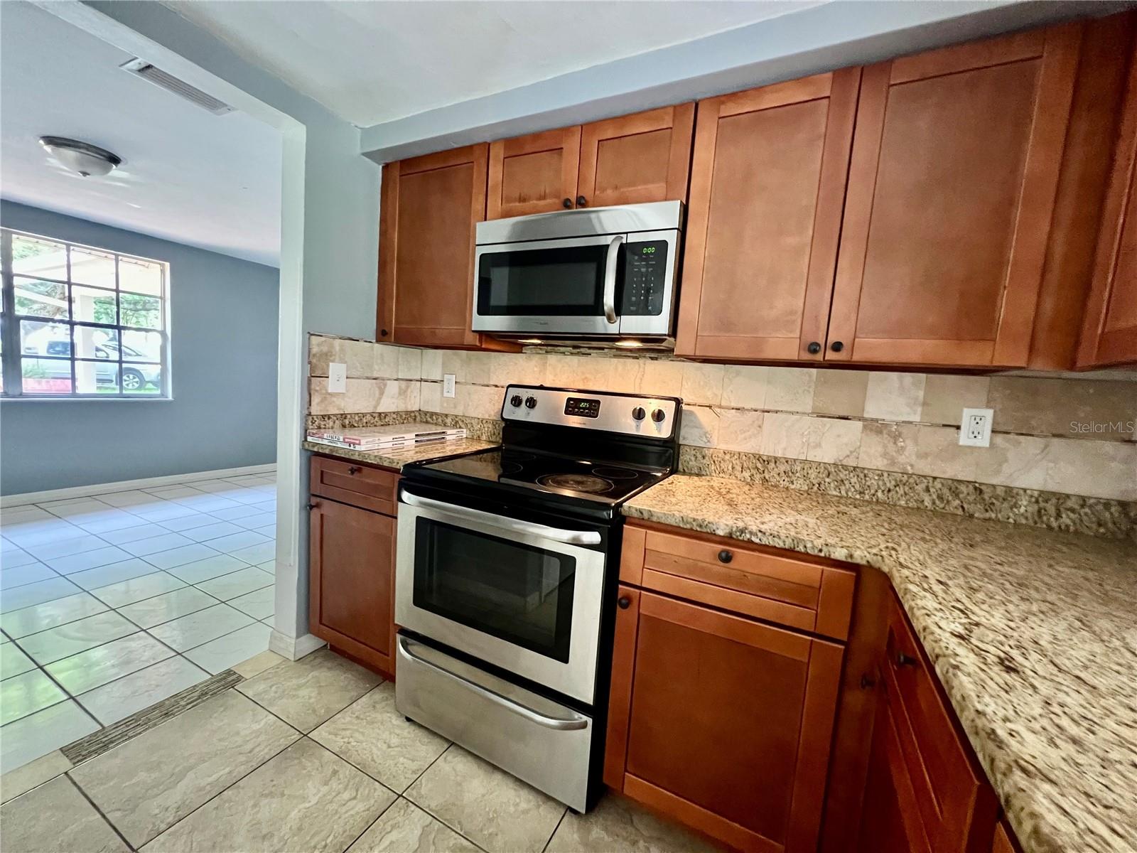 VIEW OF KITCHEN FROM  BREAKFAST AREA