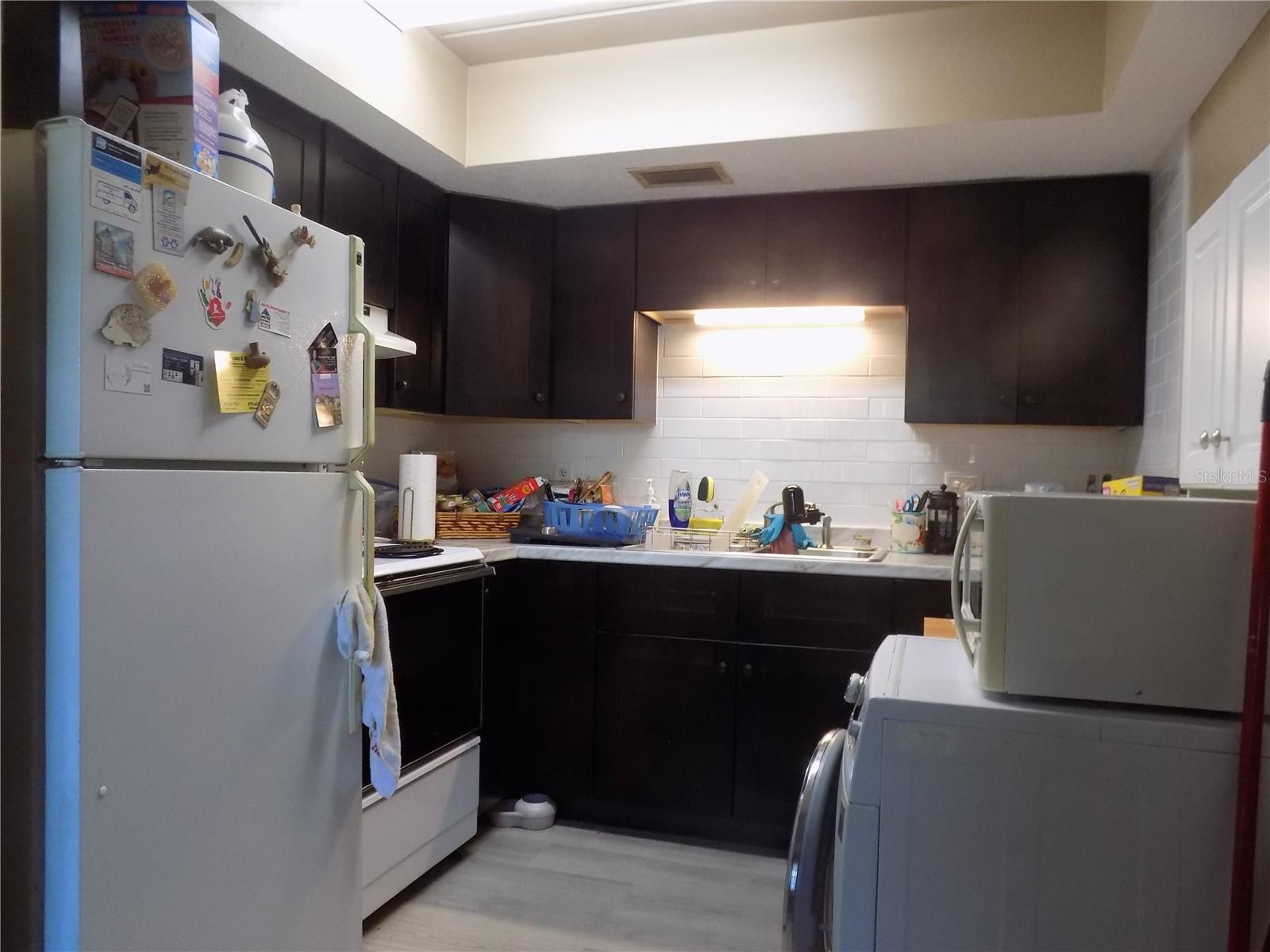 The kitchen has brand new cabinmates and counter tops, with quite a bit of storage space.