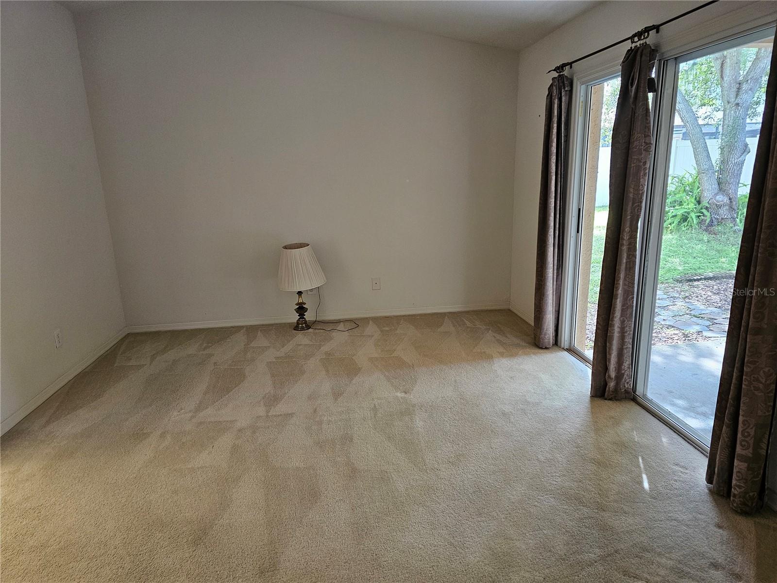 Owners Bedroom with Sliding Glass Door access to backyard