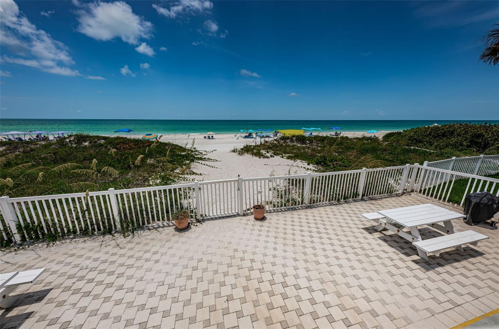 .. .. Front Porch Shot #3.... Direct West View From Le Mar Unit #104  Looking Over Common Area Towards Beach..