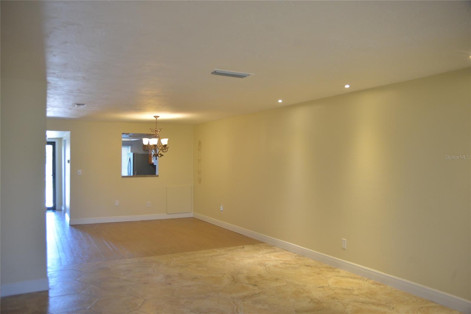 Living room towards kitchen & entry