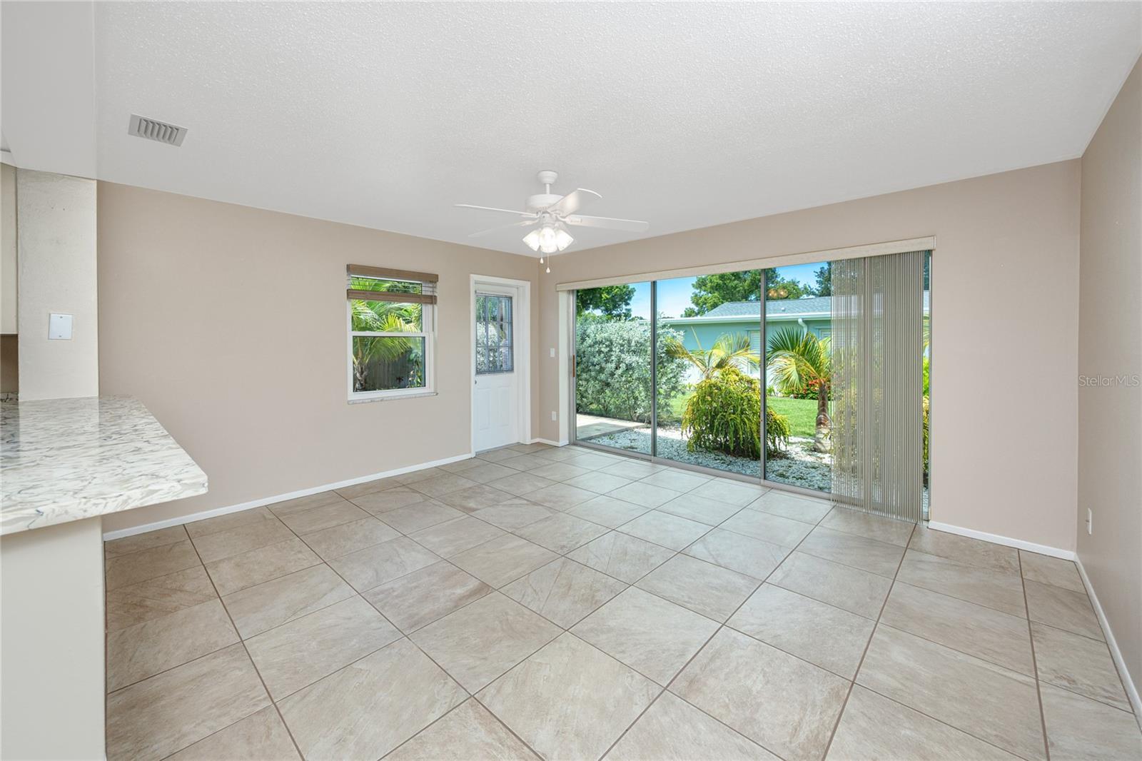 Florida room with a view of the backyard