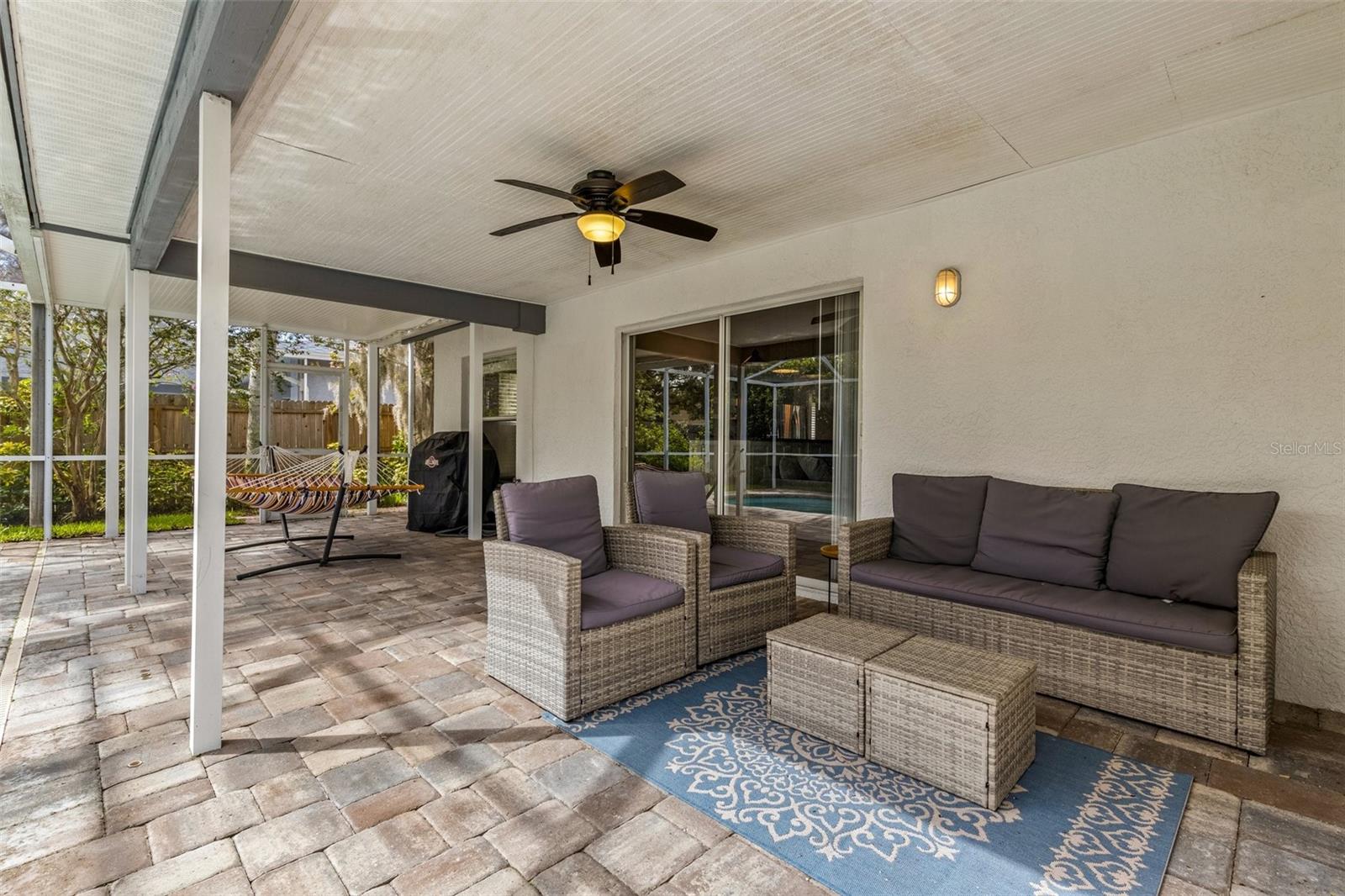 Expansive Covered Lanai adjacent to Pool