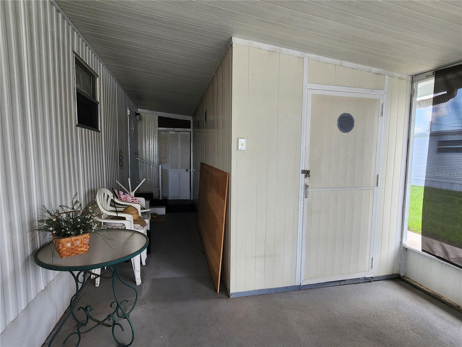 Attached utility room with washer & dryer.