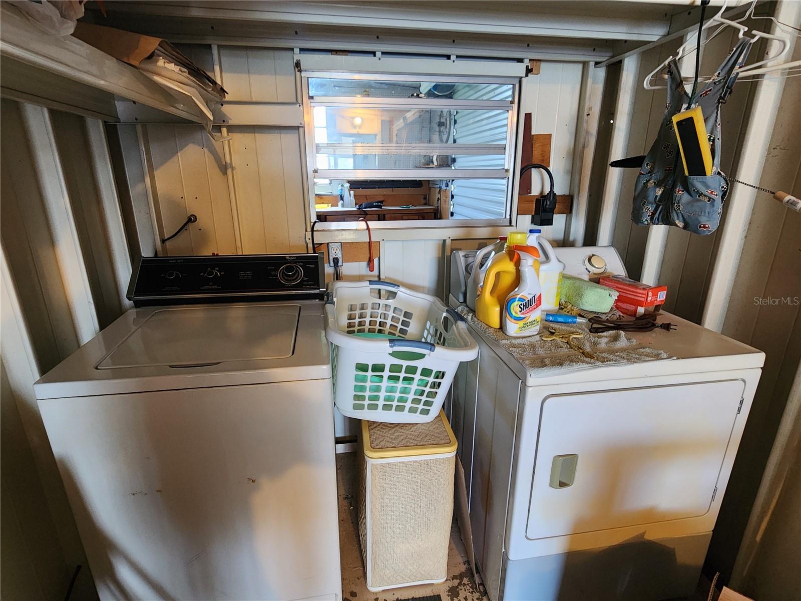 Attached utility room with washer & dryer.