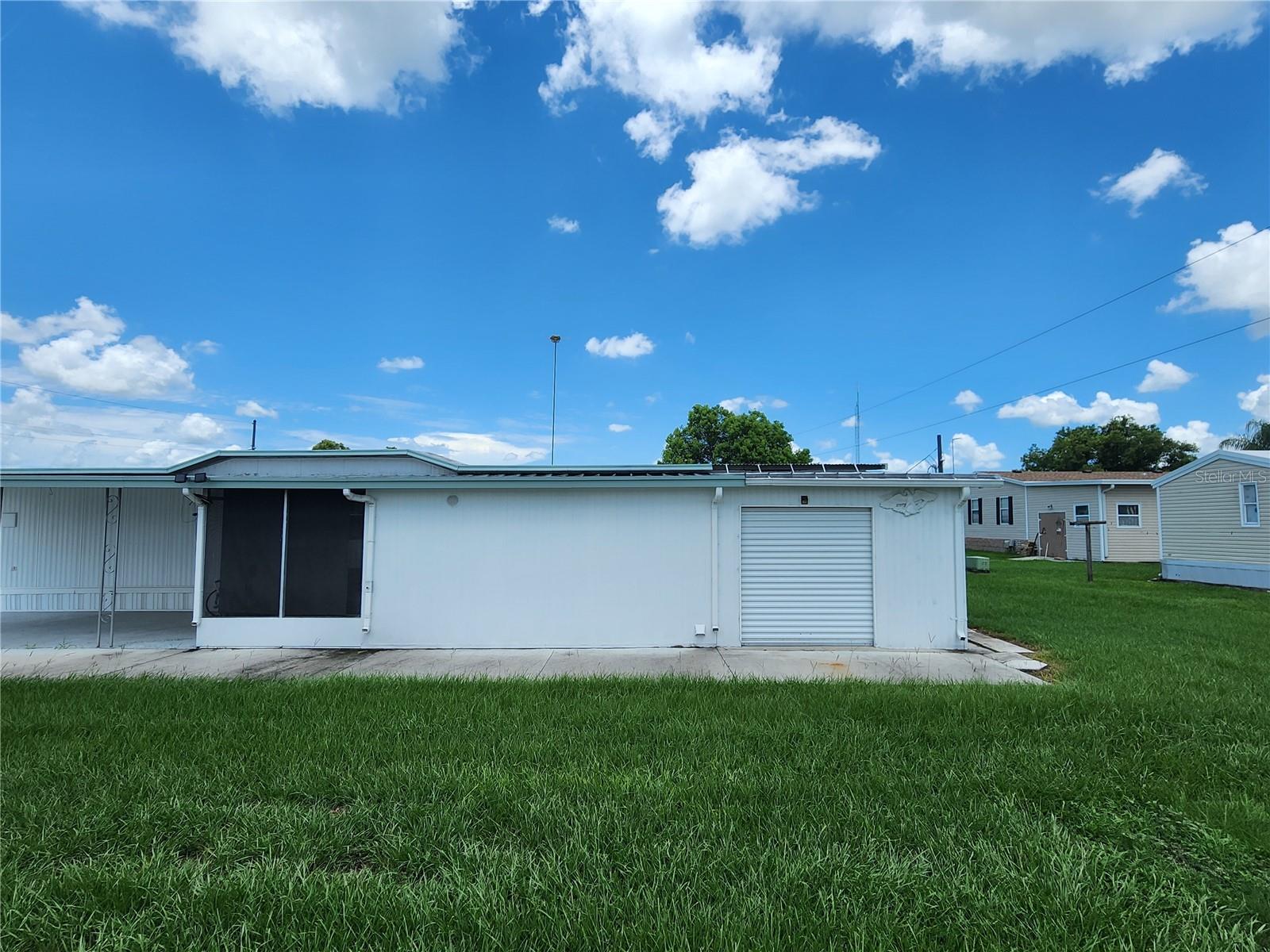 Utility room & golf cart parking garage with cart path.