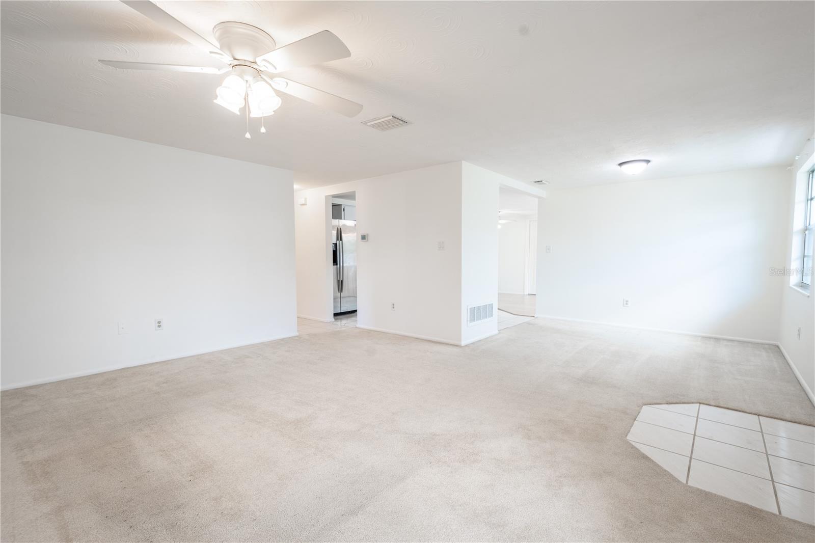 The entryway features ceramic tile flooring.