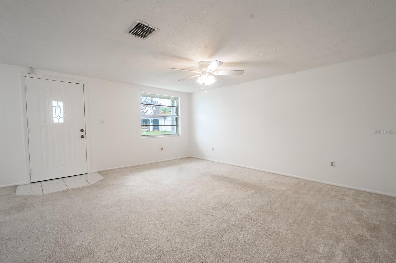 The front door opens into the living and dining rooms.