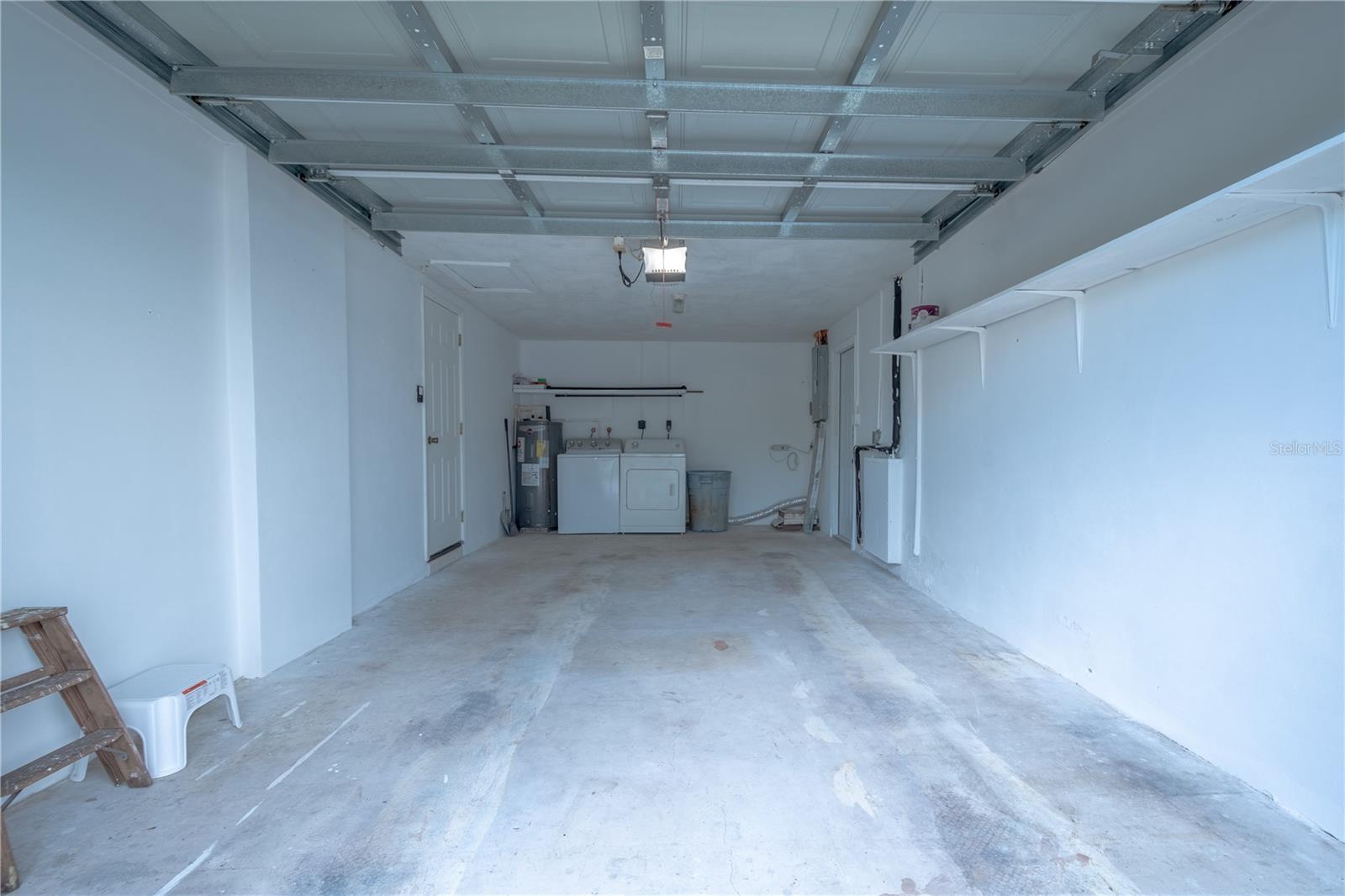 The washer and dryer are in the oversized garage with electric garage door opener.