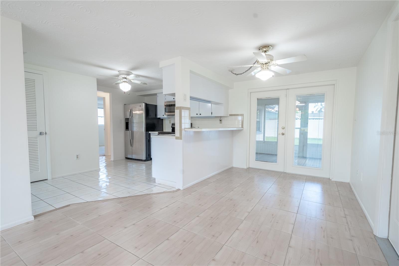 The dinette is open to the kitchen and breakfast bar.