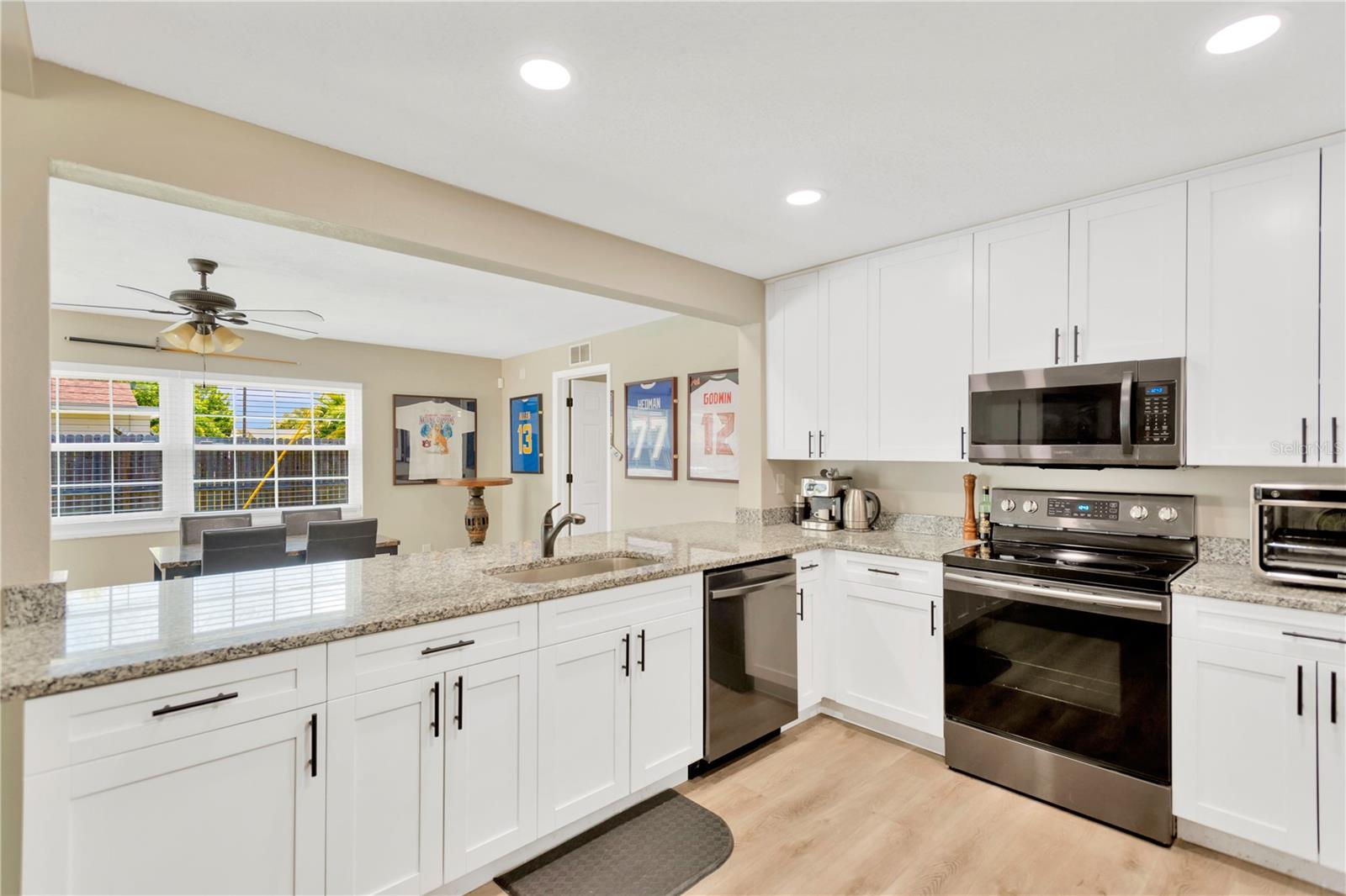 View of Kitchen & Breakfast Bar looking into Dining Area.