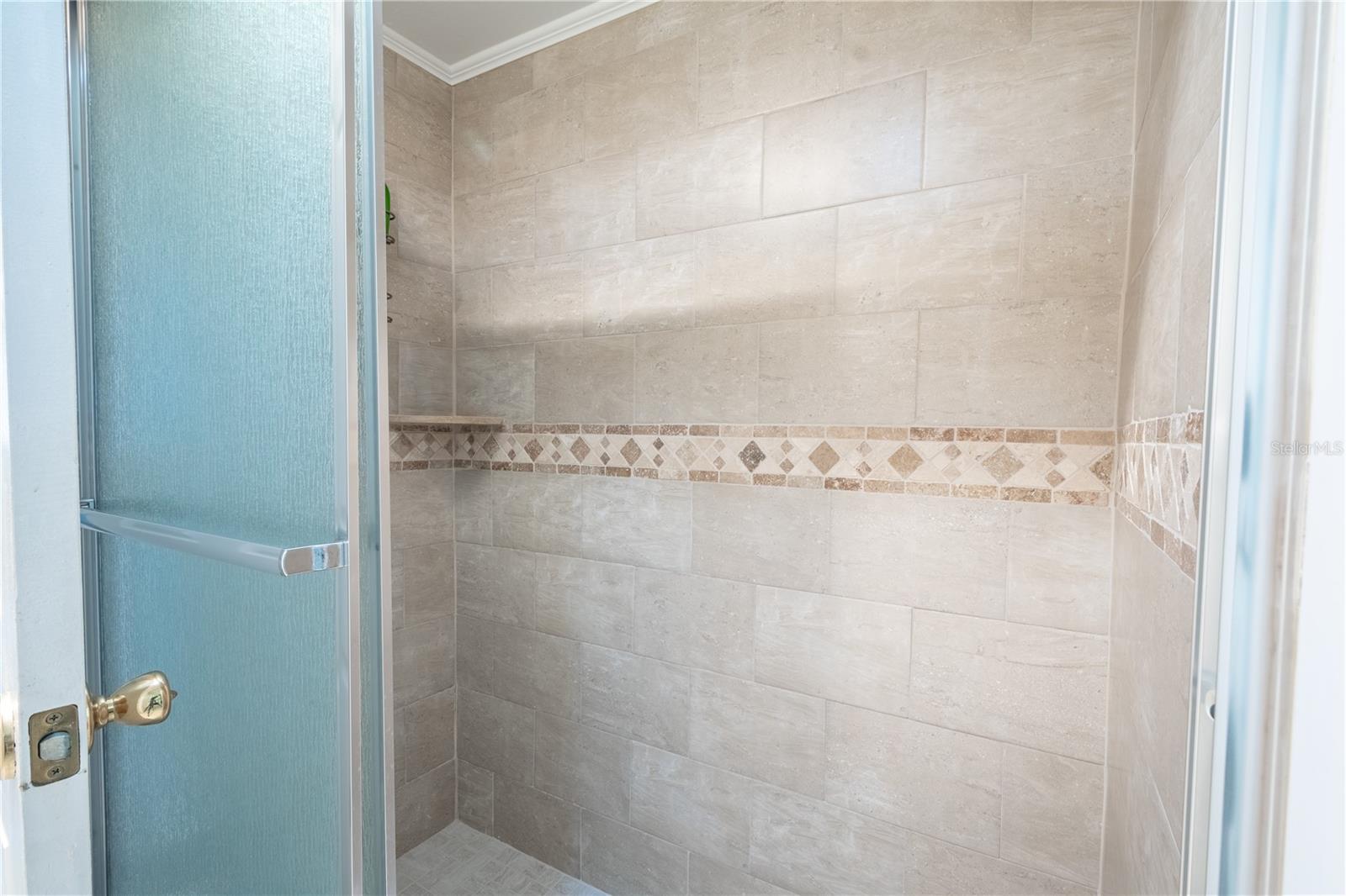 Bathroom two features a full length medicine cabinet.