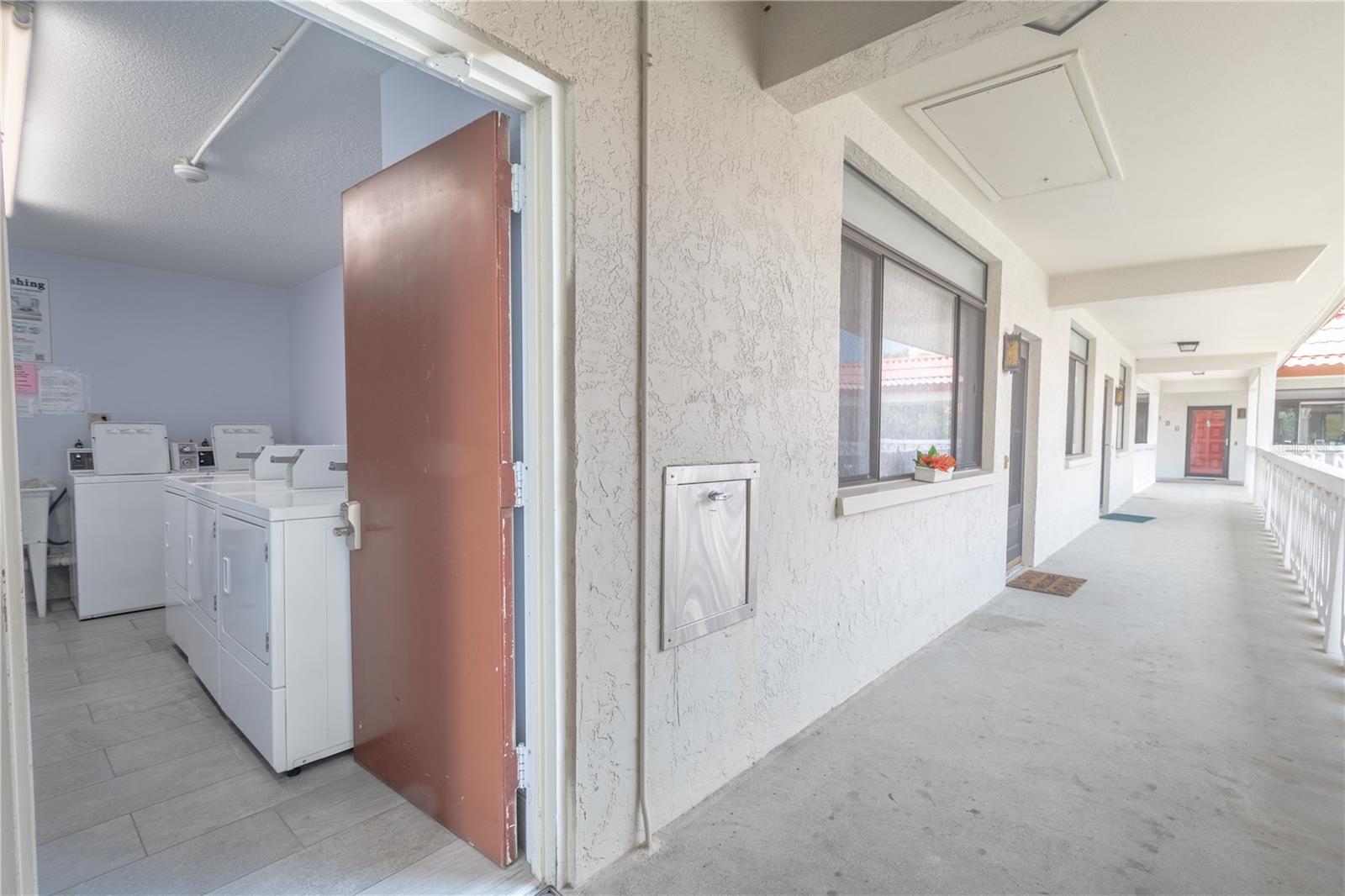 The building laundry room is steps away from the unit.