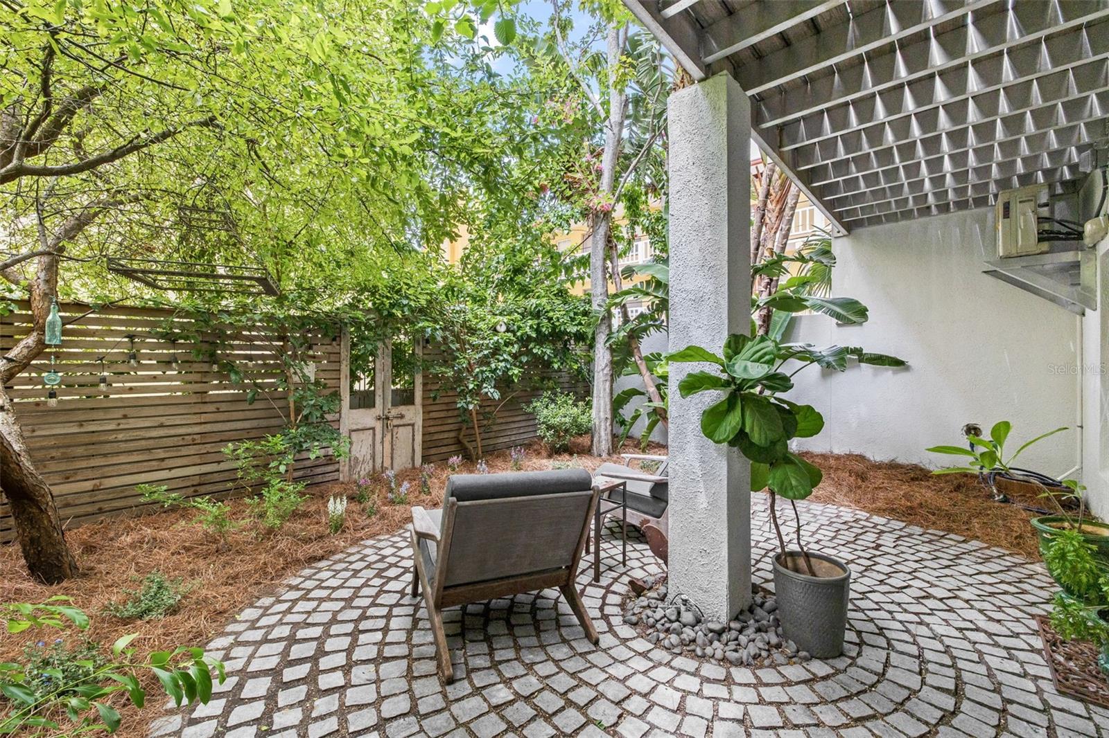 This delightful outdoor patio is private and filled with Florida native plants!