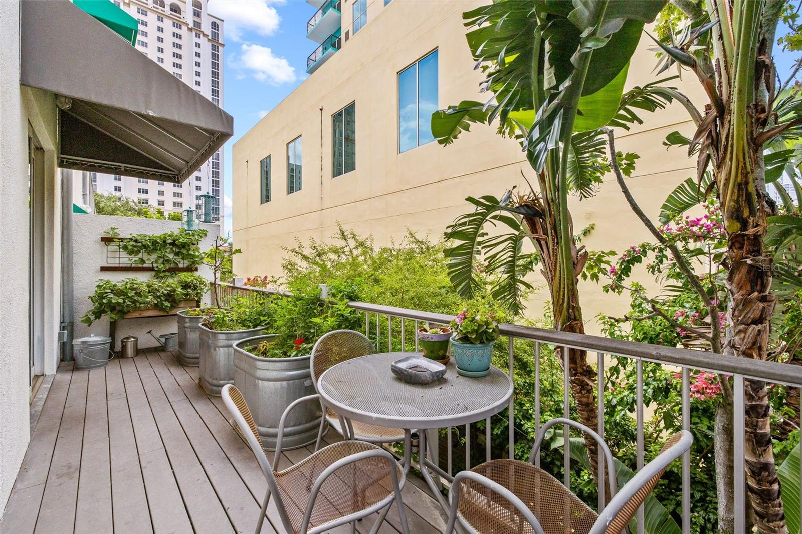 So not only do you have the large private courtyard but also this large second floor balcony - still very private with planters and bird feeders!