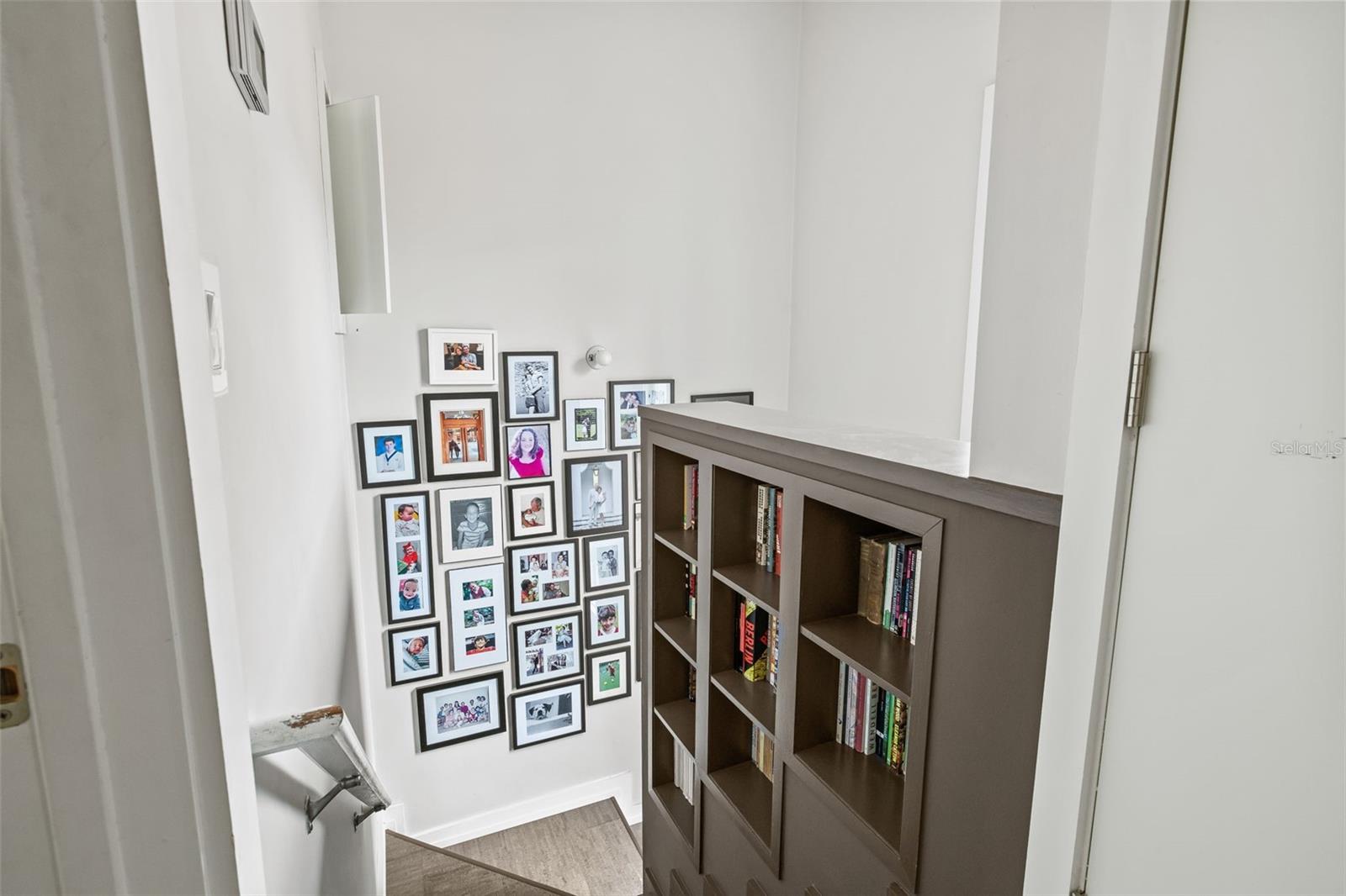 As you walk up the stairs to the bedroom(s) is a built in book shelf.