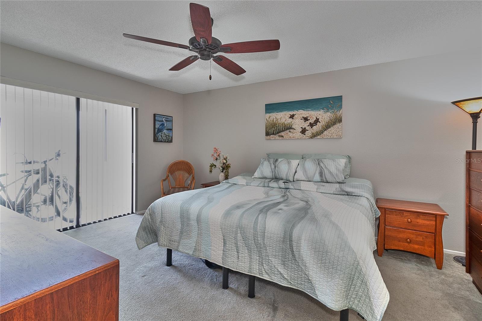 Primary Bedroom and View of Enclosed Sun Porch