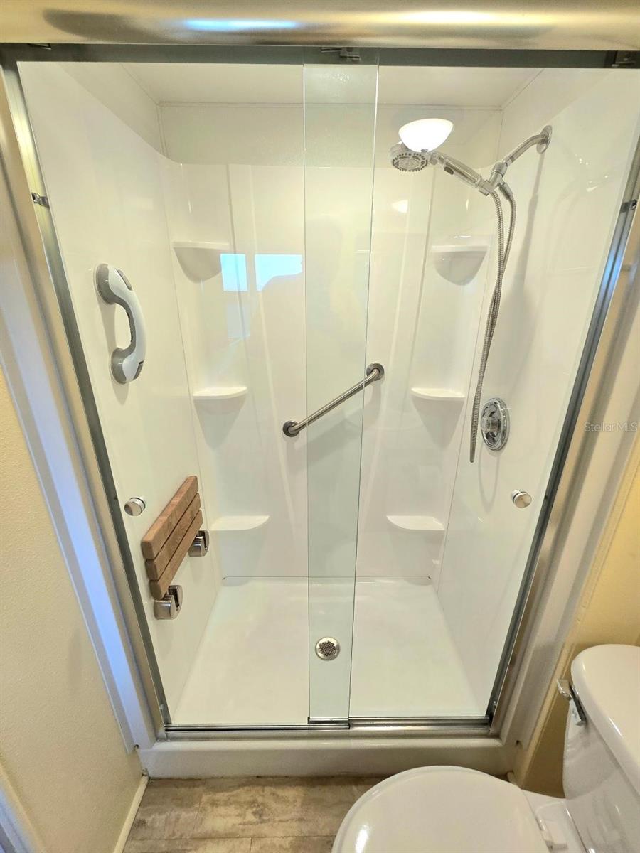 Beautiful shower with seat and rails in Primary bath