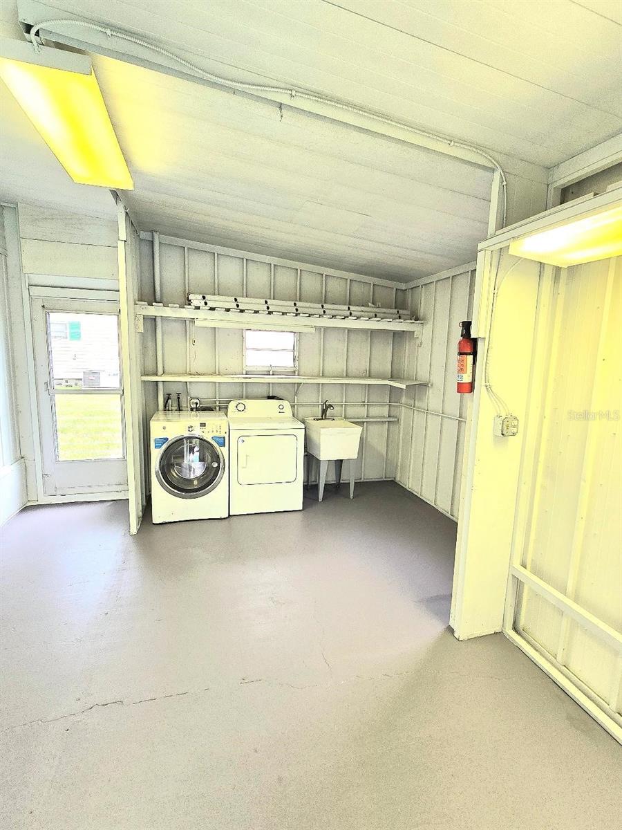 Huge laundry room has extensive storage space!