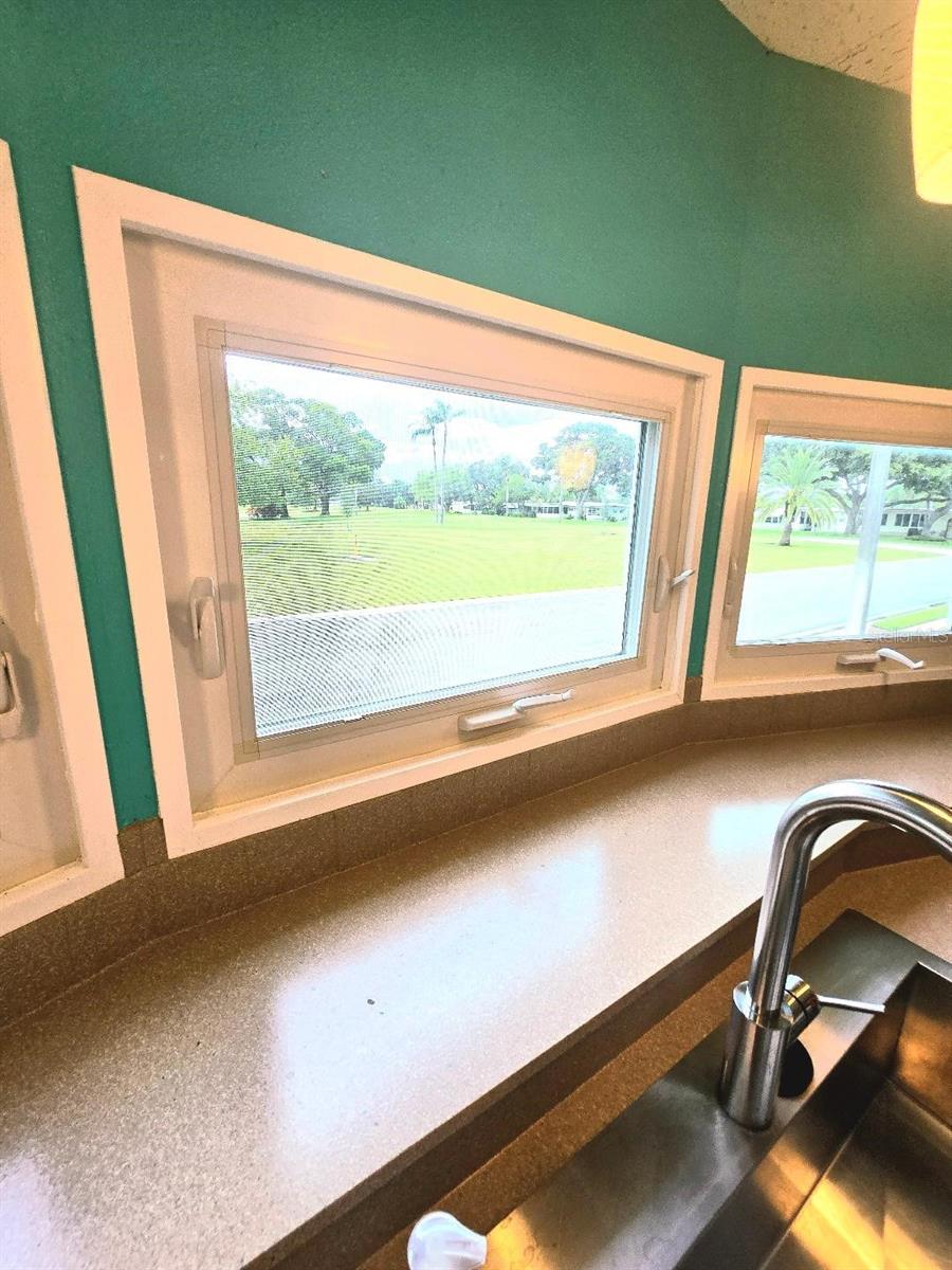 View of golf course from the kitchen sink.