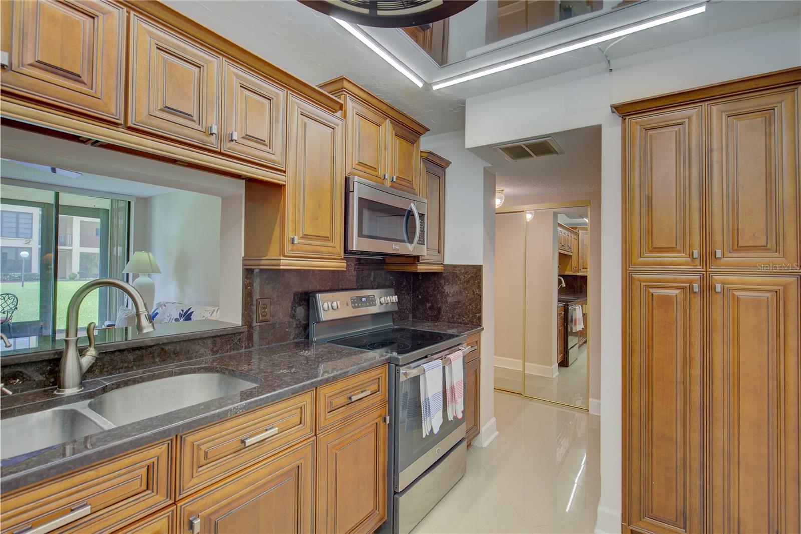 Solid wood cabinetry also makes a pantry.