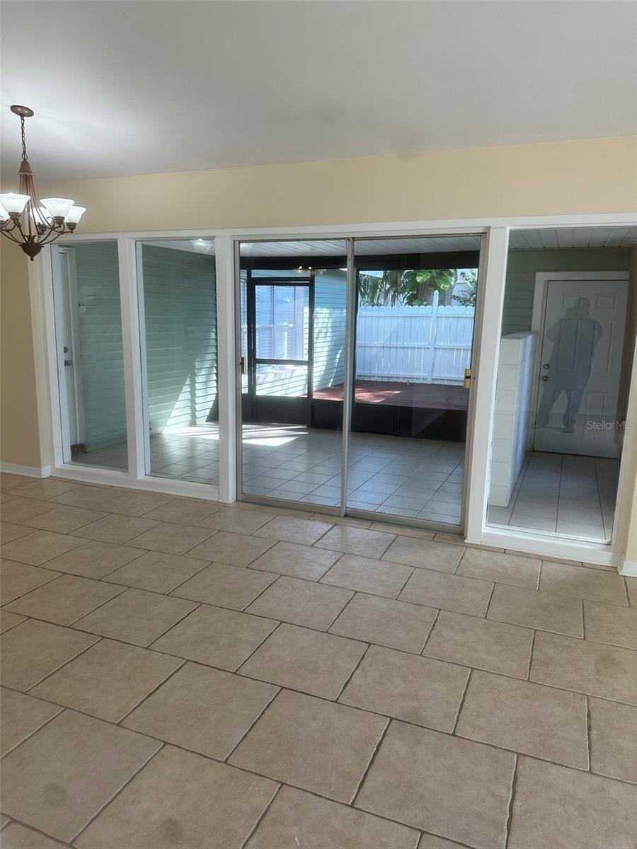 Dining room area facing screened in patio and deck