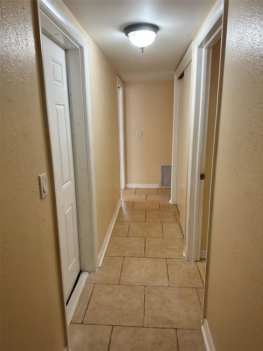 Hallway all three bedroom; bathroom and 2nd door to patio