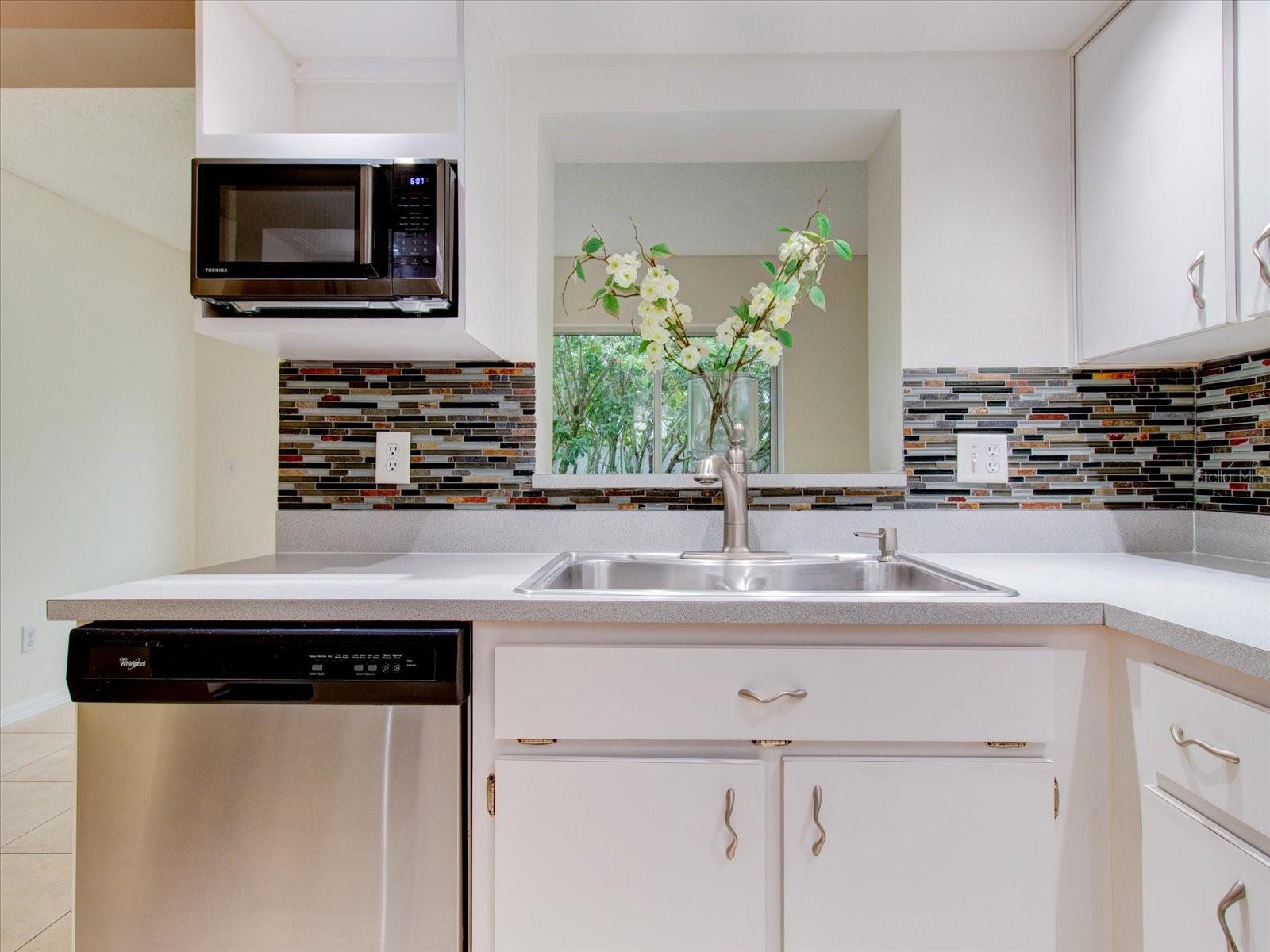 Side view of the kitchen and the den/study is directly behind the kitchen