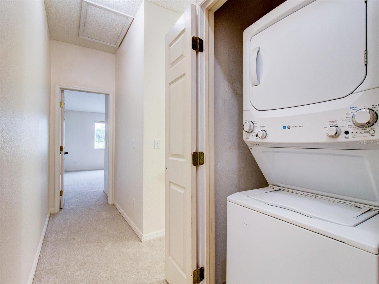 Second Floor: Laundry Room and the Primary En-Suite Bedroom Door Entrance