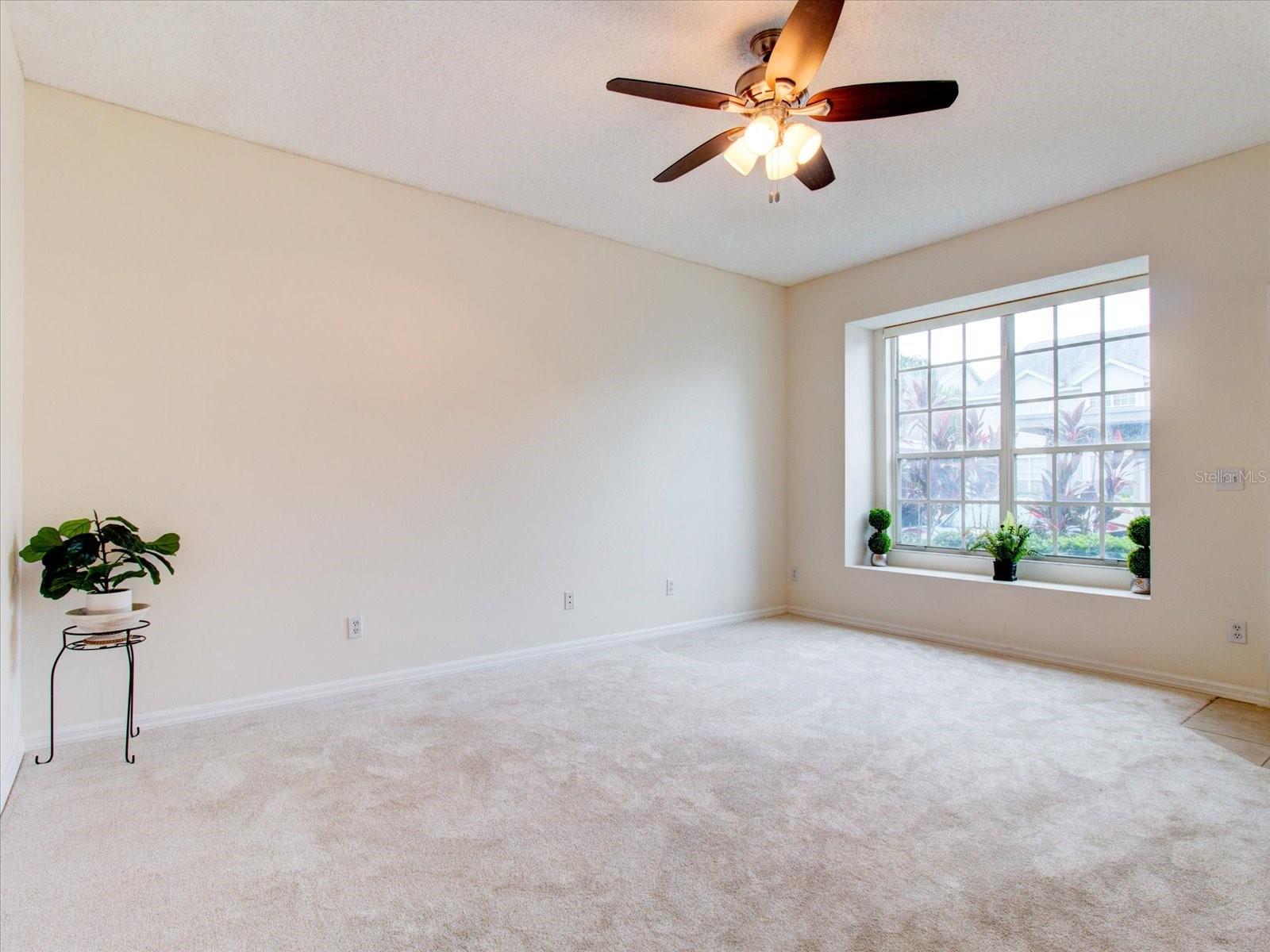 First Floor: Living Room View With A Ceiling Fan With A Light!