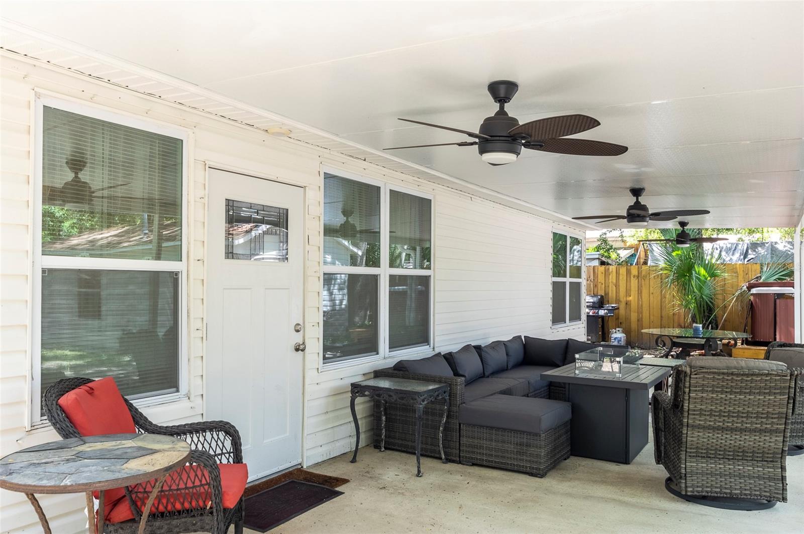 Covered back patio with fans and lights.