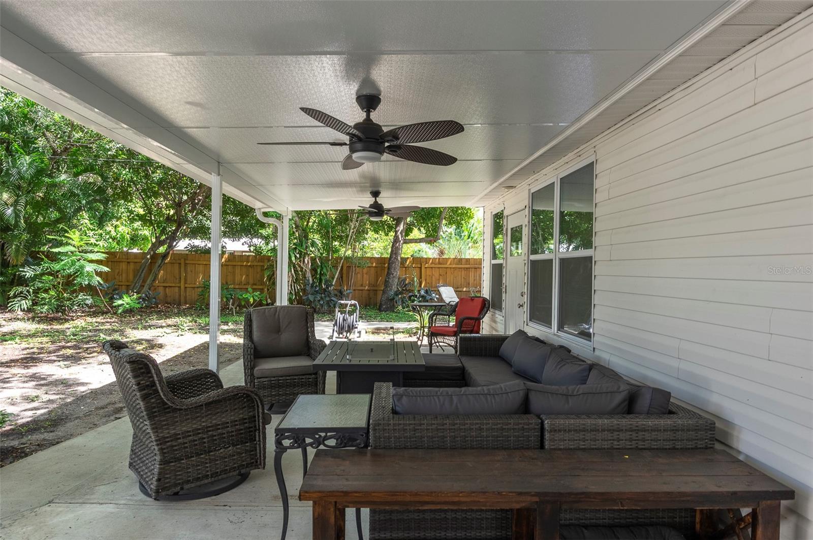 Covered back patio, overlooking oversized fully fenced in yard